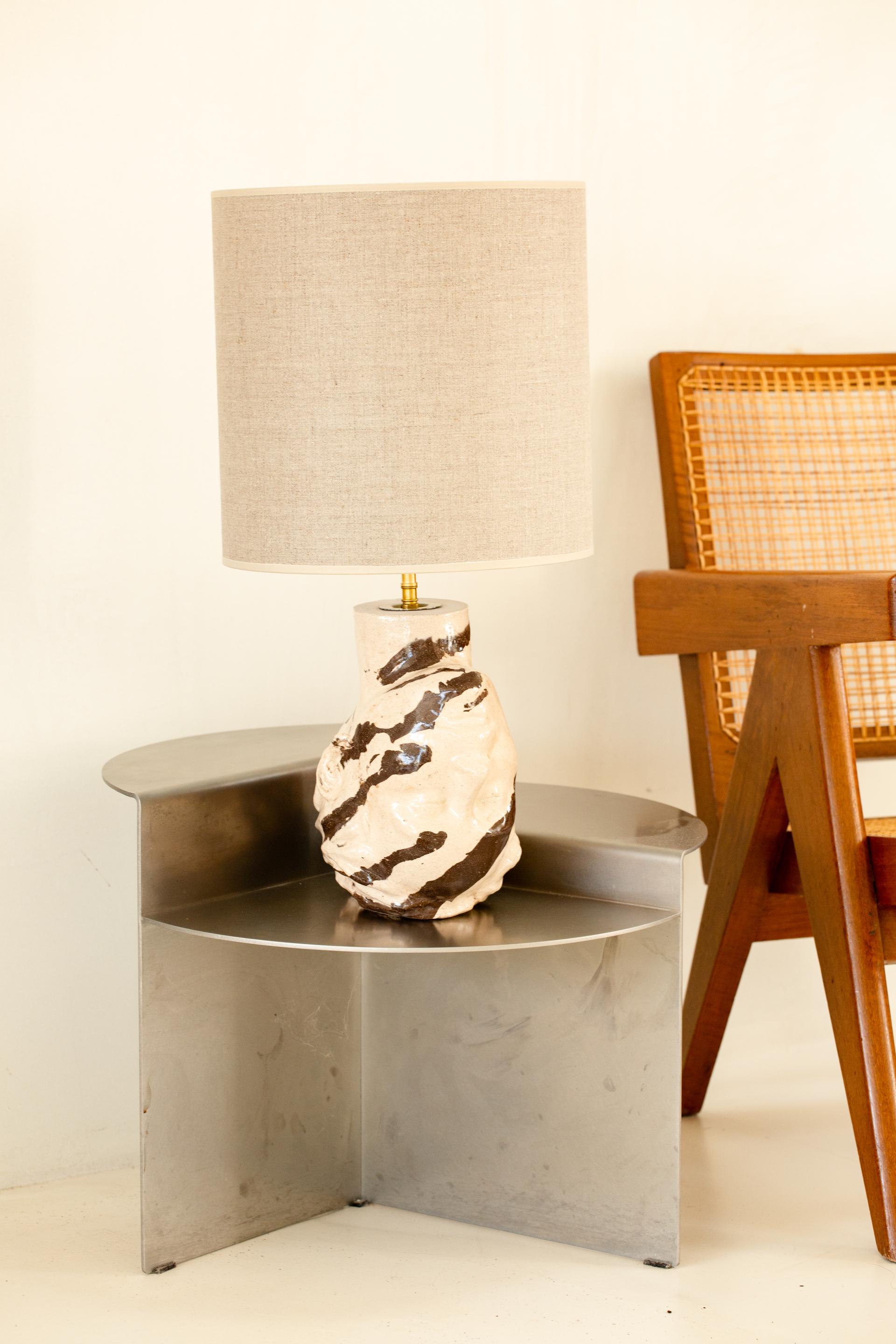 Upside Down Head Table Lamp by Di Fretto
Dimensions: W 23 x D 16 x H 25 cm (measure without lampshade)
Materials: Brown and White Glazed Faience

Lampshade included / Dimension: ⌀ 30 x H 30 cm


Aurélie Fretti, exploration and sculpture

DiFretto