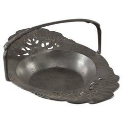 Antique Urania. An Art Nouveau pewter fruit bowl with a loop handle floral decoration
