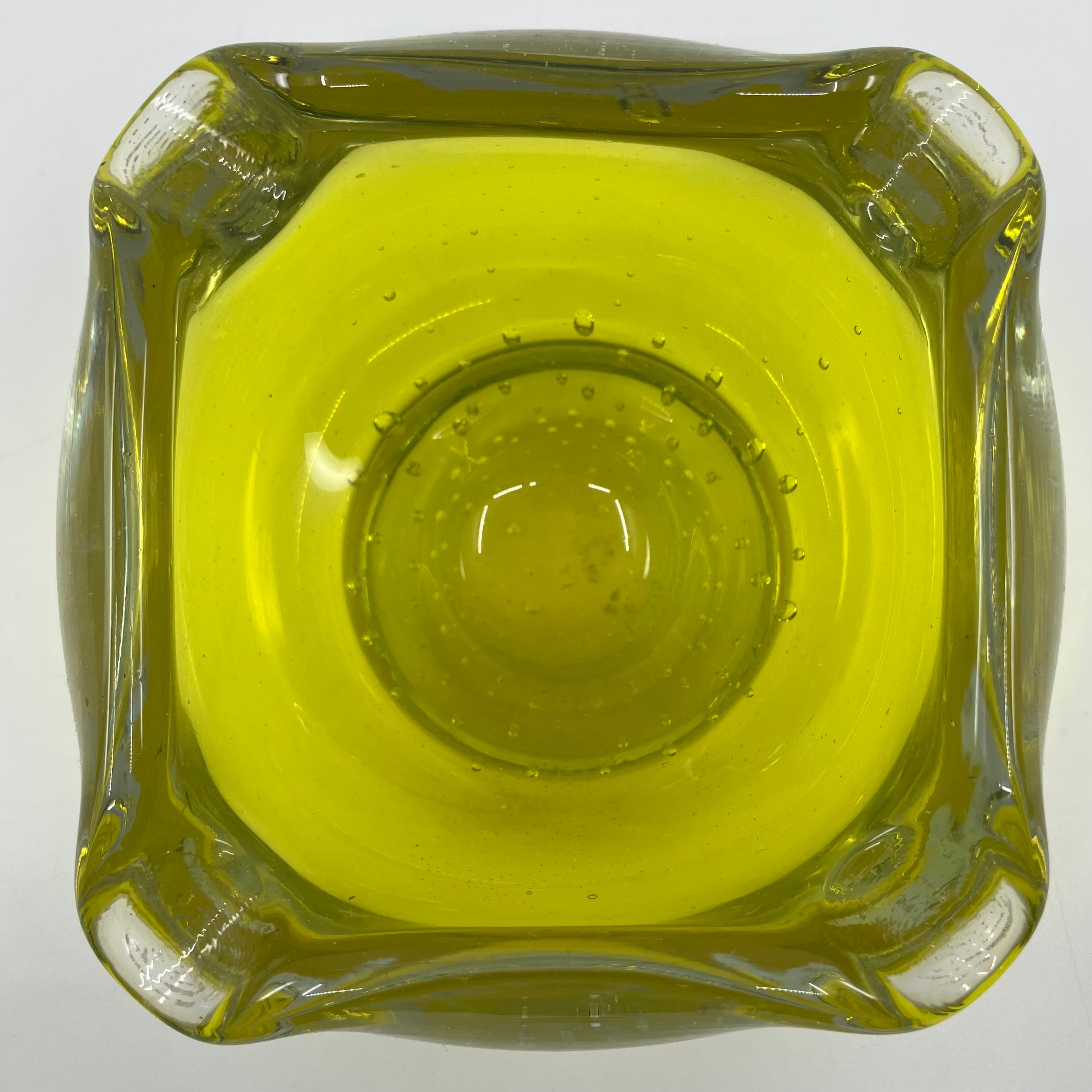 Uranium glass ashtray. Acid green uranium glass bubble bowl ashtray with four lobed corners on circular base. Continental, Mid-20th century. 
Dimensions: 6