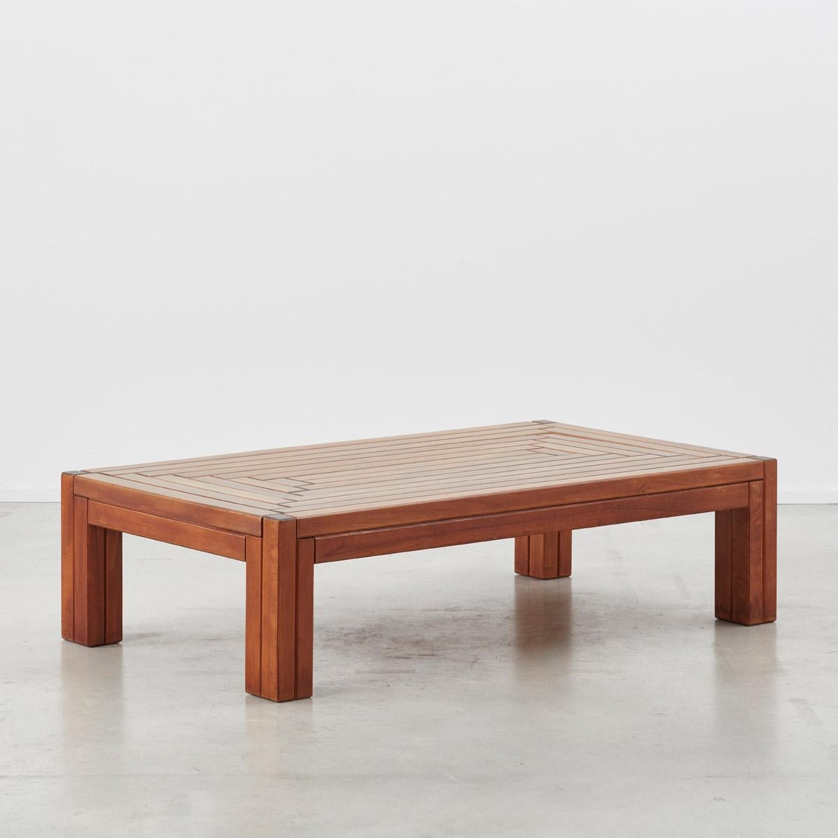 This solid wood coffee table, possibly made of elm, was designed and crafted by multidisciplinary artist and designer Urano Palma. A figure of the Avant Garde, Palma was perhaps best known for his intricate handmade pieces in wood, such as this