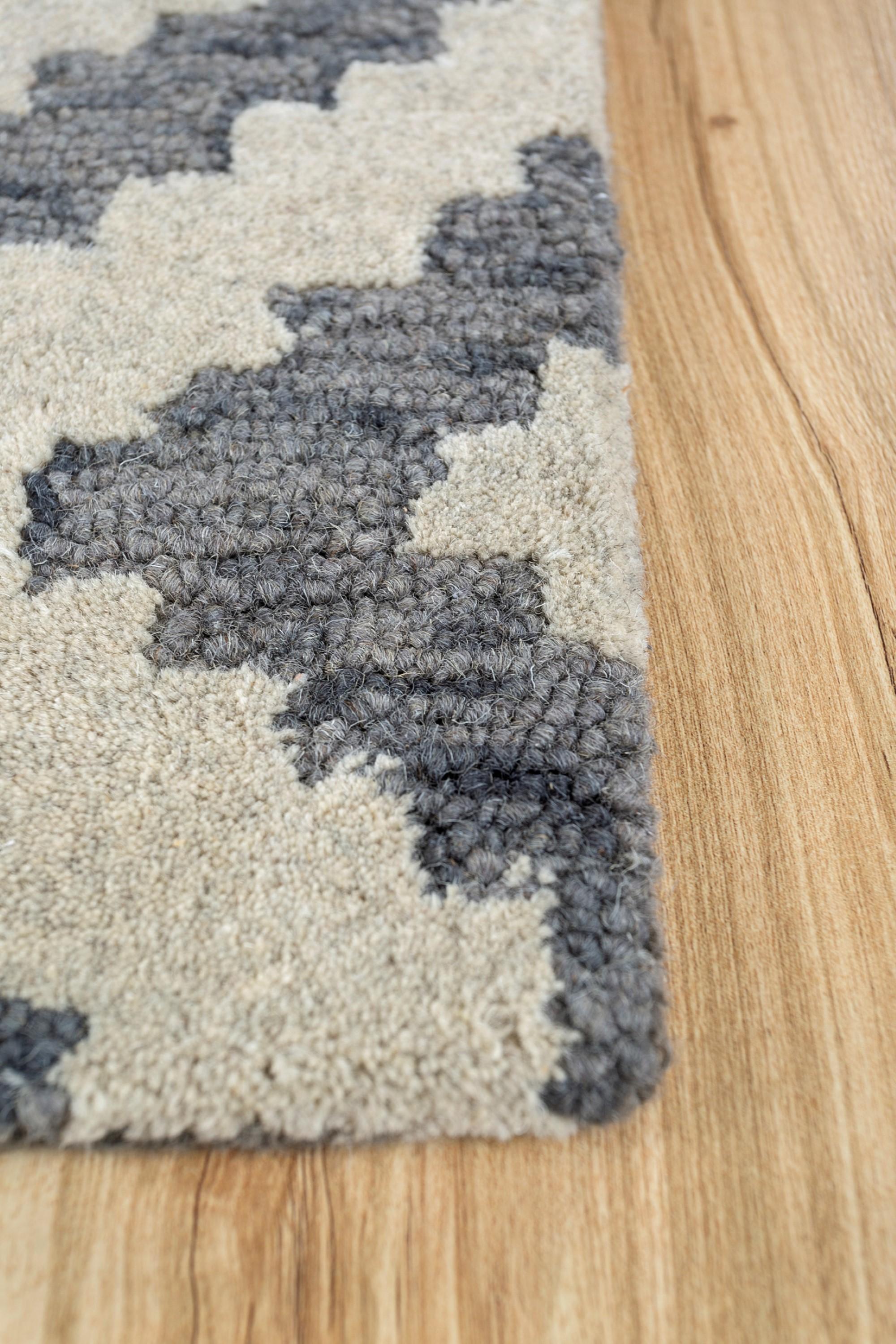 Have you considered turning your floor into a canvas of modern elegance? Our hand-tufted rug, meticulously crafted in standard sizes including 274X365, 244X304, 183X274, 183X183, 152X244, 123X183, 92X152, 76X304, and 304X427 cm, invites you to