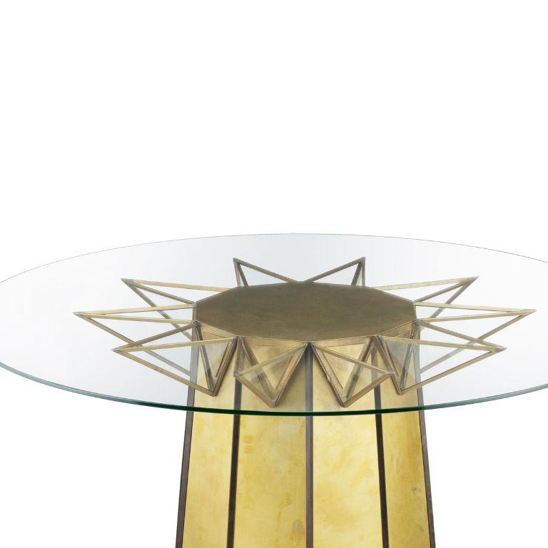 Add a touch of whimsy to your decor with our charming Circus table. This delightful piece features a sturdy brass structure and a sleek glass tabletop. The brass structure provides durability and a touch of elegance, while the glass tabletop adds a
