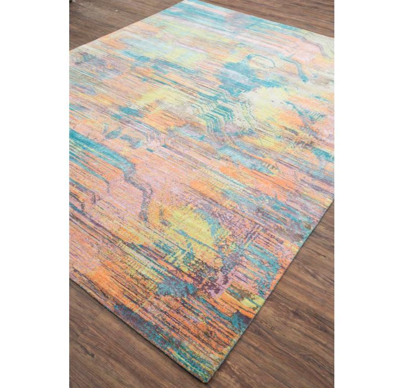 This rug from our Unstring By Kavi collection blends contemporary design and traditional craftsmanship, offering a visually striking living space. This rectangular rug features a sophisticated pattern in classic gray, creating a timeless and