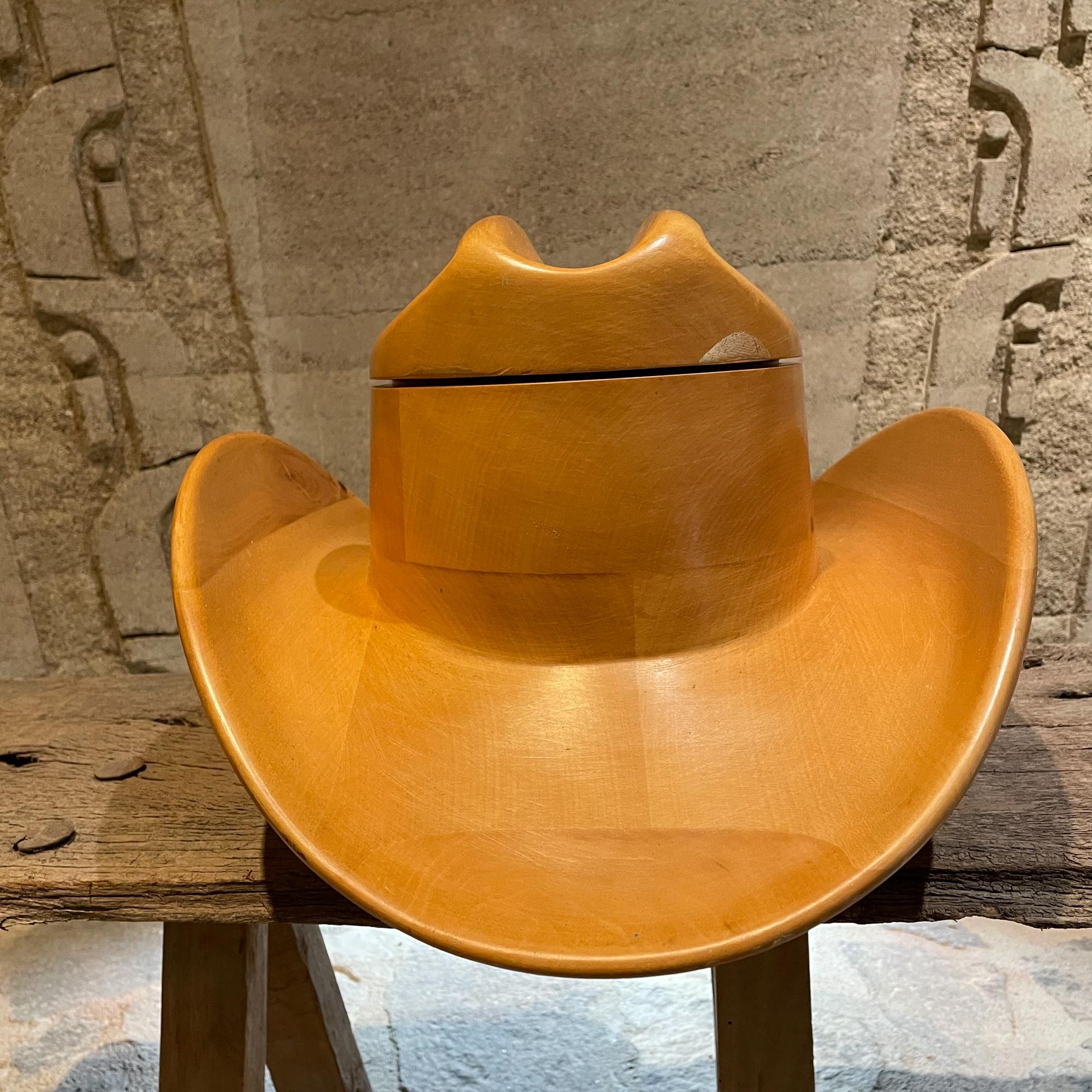 Urban Italian Cowboy Western Stetson hat shaped ice bucket 1970s
Designer is cabinetmaker Alessandro Bini
Signed underneath BINI, ALFONSO BINI made in Italy 1970s Firenze
Made with Carved Blonde Italian Wood Maple Planks 
Size: 11 H x 20 D x