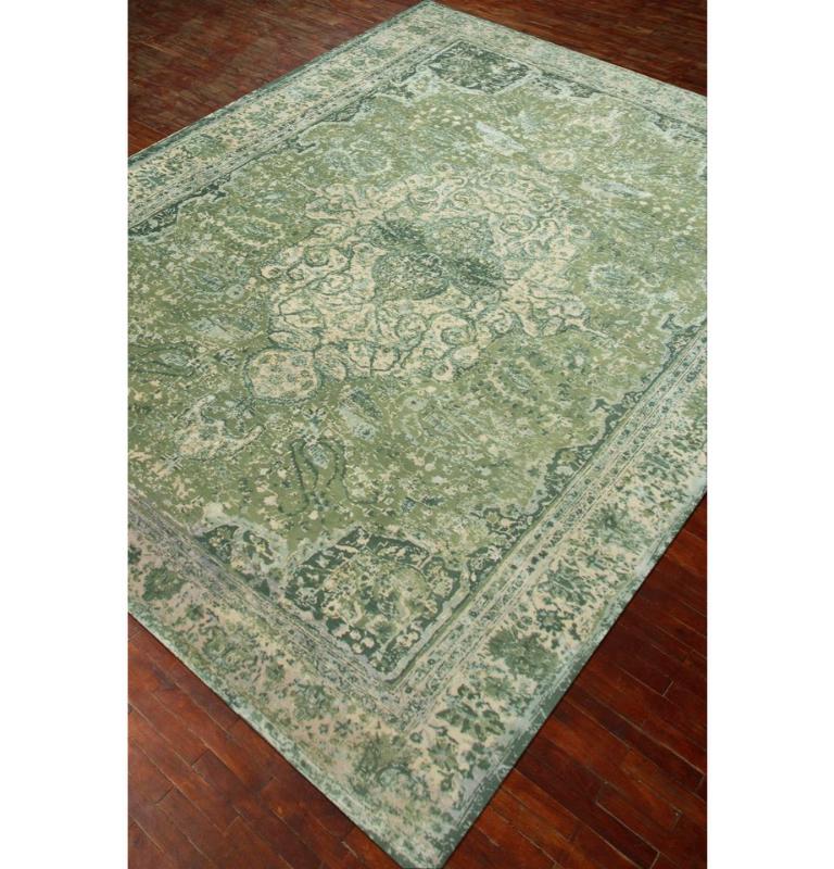 Unravel the tapestry of modern artistry with handknotted masterpiece, a harmonious fusion of unpolished yarn knots and rural Indian craftsmanship. Lost in translation between hand and machine, this rug transcends convention, unveiling crumbling