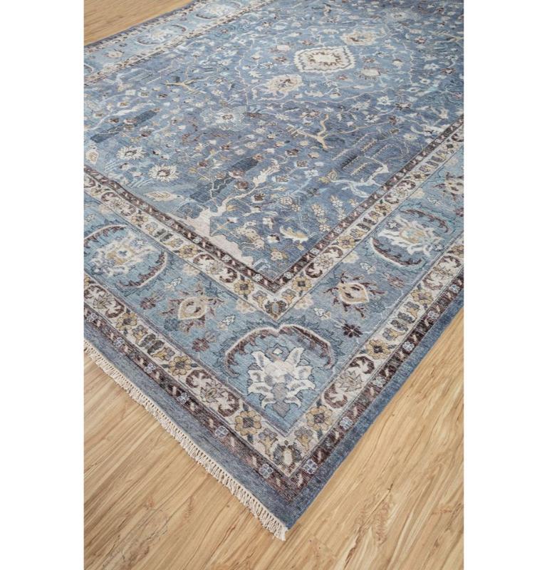 Take a captivating journey through history and style with our Hand Knotted Wool Rug. This remarkable piece seamlessly blends traditional heritage with modern living. Its stunning design transports you to a bygone era, combining vintage allure with