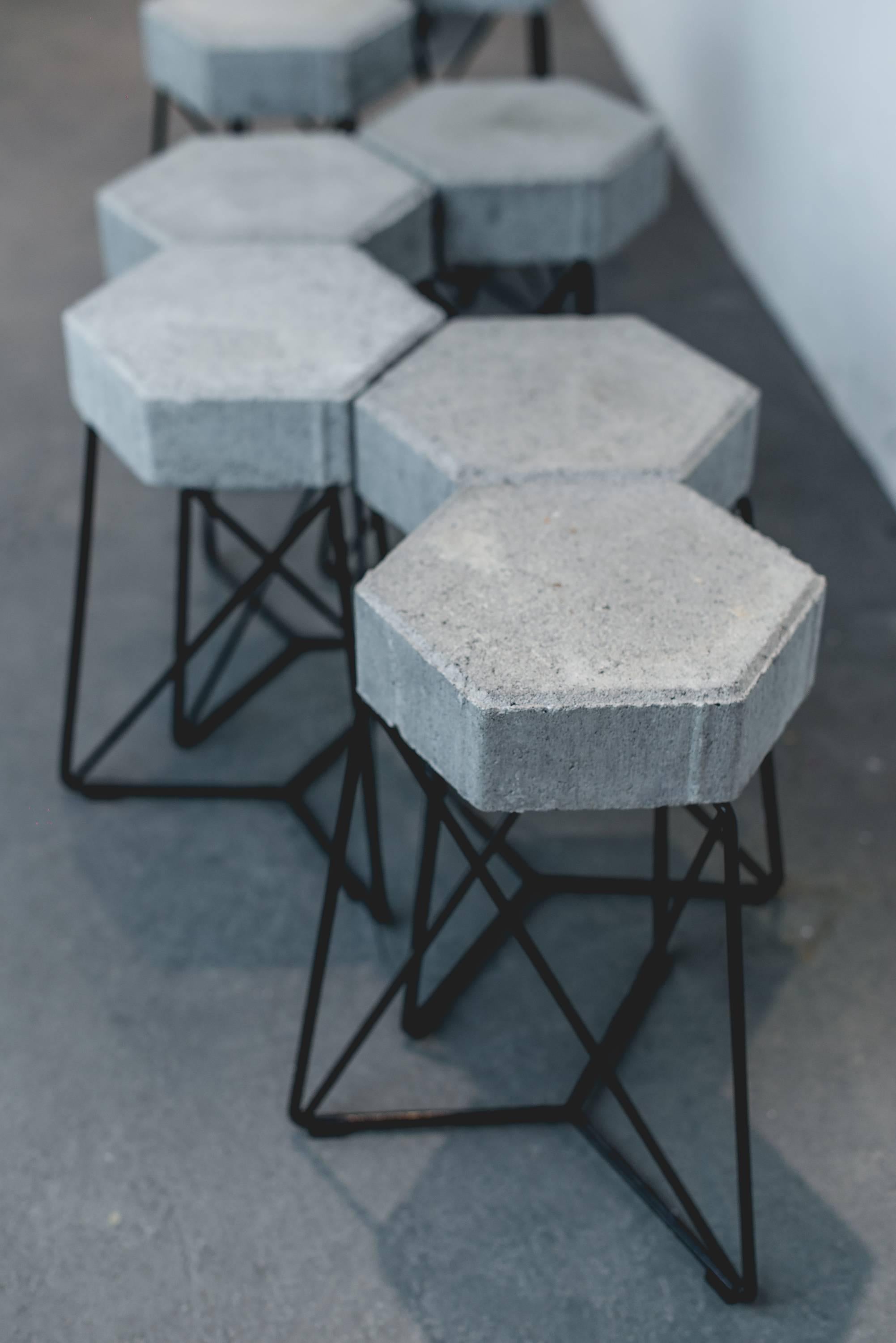 The URBE stool is an use adaptation from an imaginary urban element, where the seat creates a relation between its weight and lightness with the structure. The seat is a concrete block and its structure is made of solid iron finished in black