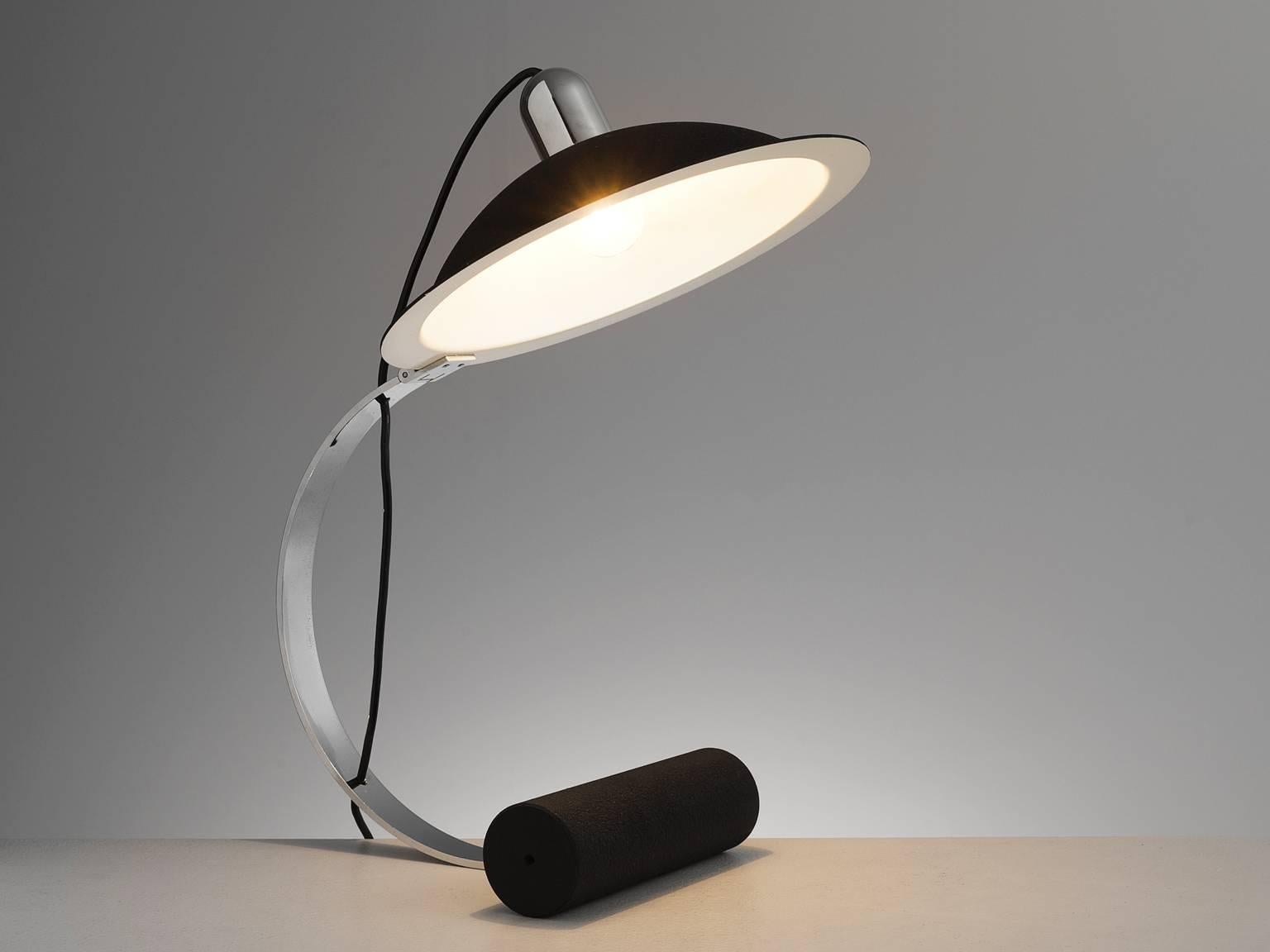 Donato D'urbino, De Pas Jonathan and Paolo Lomazzi for Stilnovo, table lamp by Italy, 1971. 

The lamp has a top which is shaped as if it were a metal painted hat. The light features a heavy, cylinder shaped base. The top and the frame are of