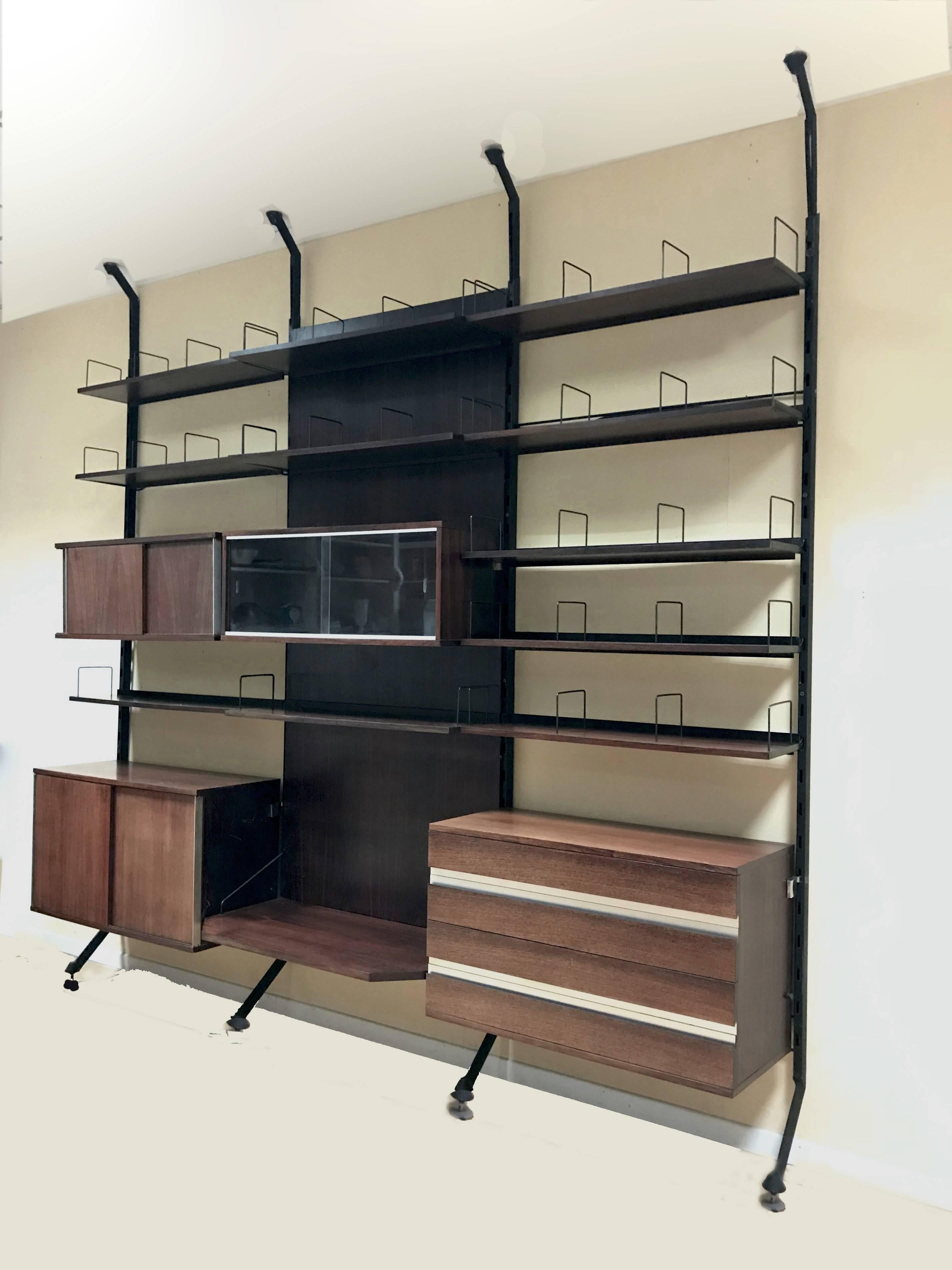 This bookcase with four wood feet was designed by Ico Parisi for MIM Roma.