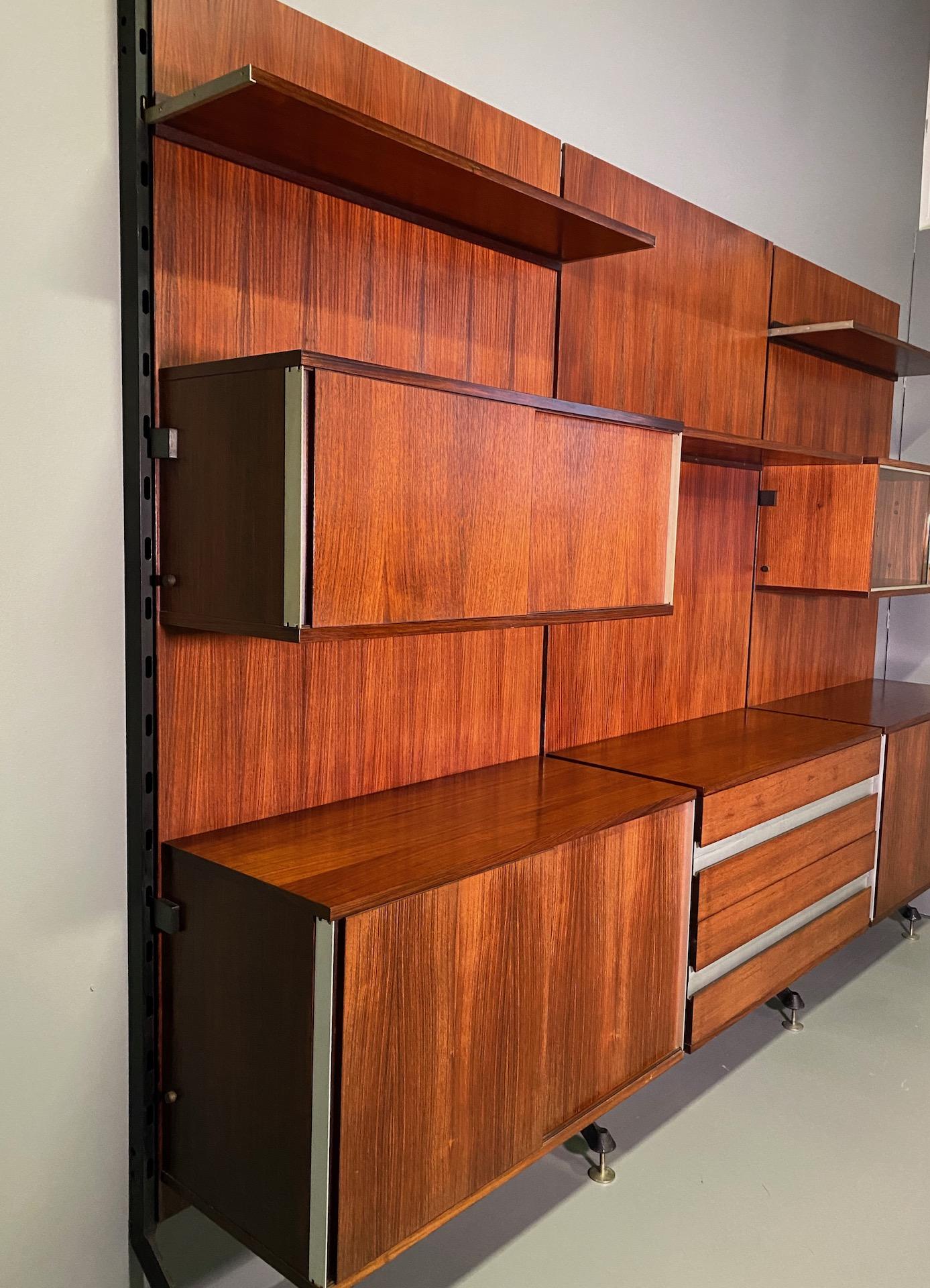 Urio wall system in palisander wood designed in 1957 by Ico Parisi for MIM Roma, Italy. Different elements including shelves, desk, chest of drawers and cupboards with sliding doors.