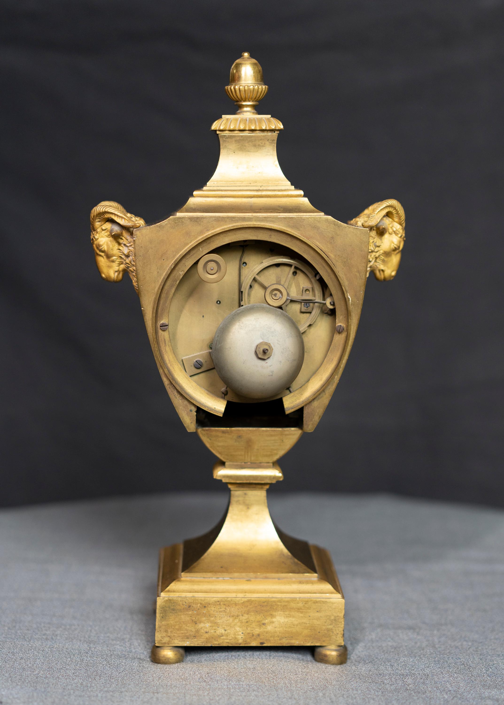 Late 18th Century Urn Shaped Louis XVI Period Gilt Bronze Rams Head Clock For Sale