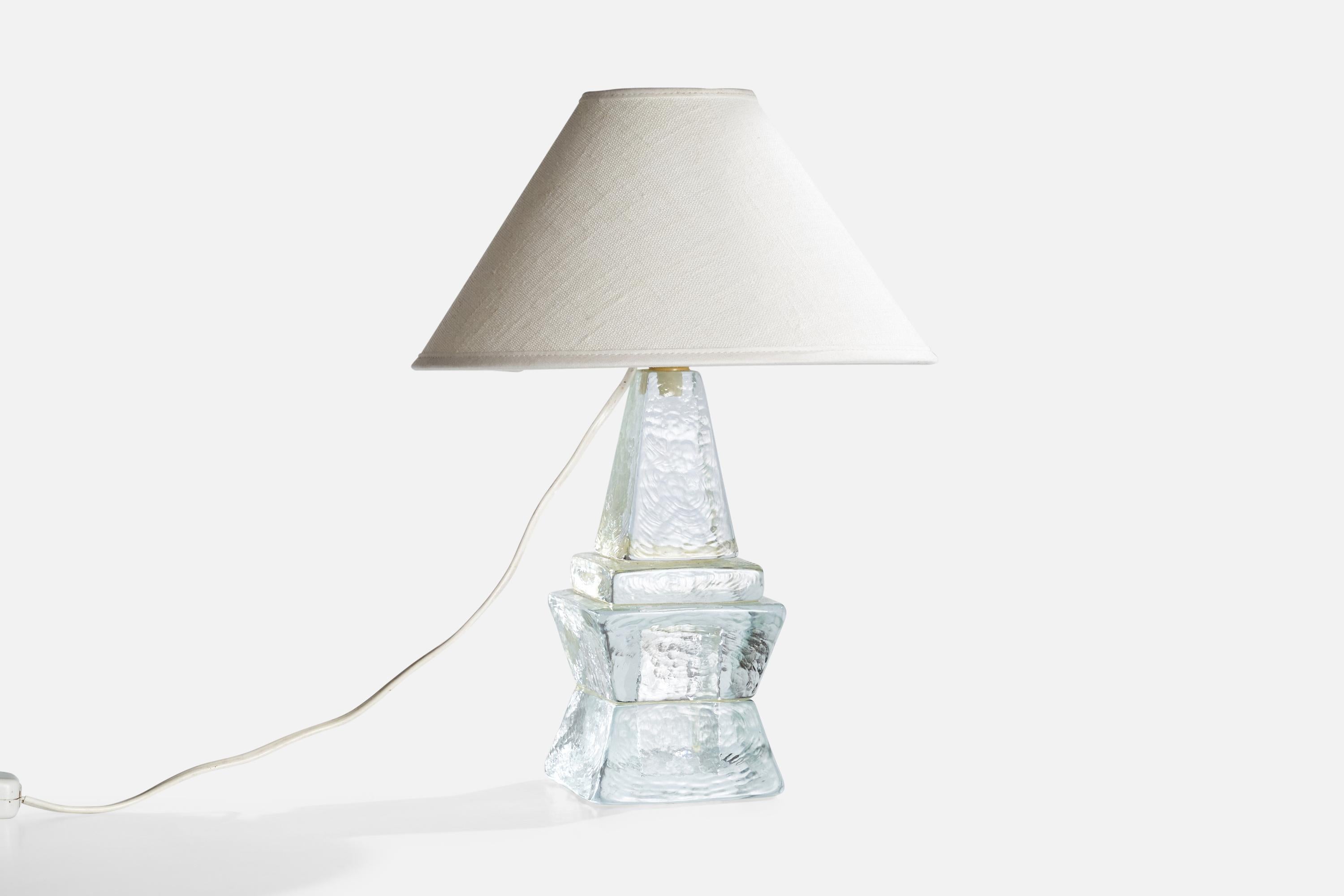 A glass table lamp attributed to Urshult Glasbruk, Sweden, c. 1960s.

Dimensions of Lamp (inches): 10.25” H x 3.75“ Diameter

Dimensions of Shade (inches): 3.25“ Top Diameter x 10“ Bottom Diameter x 6.3“ H

Dimensions of Lamp with Shade (inches):