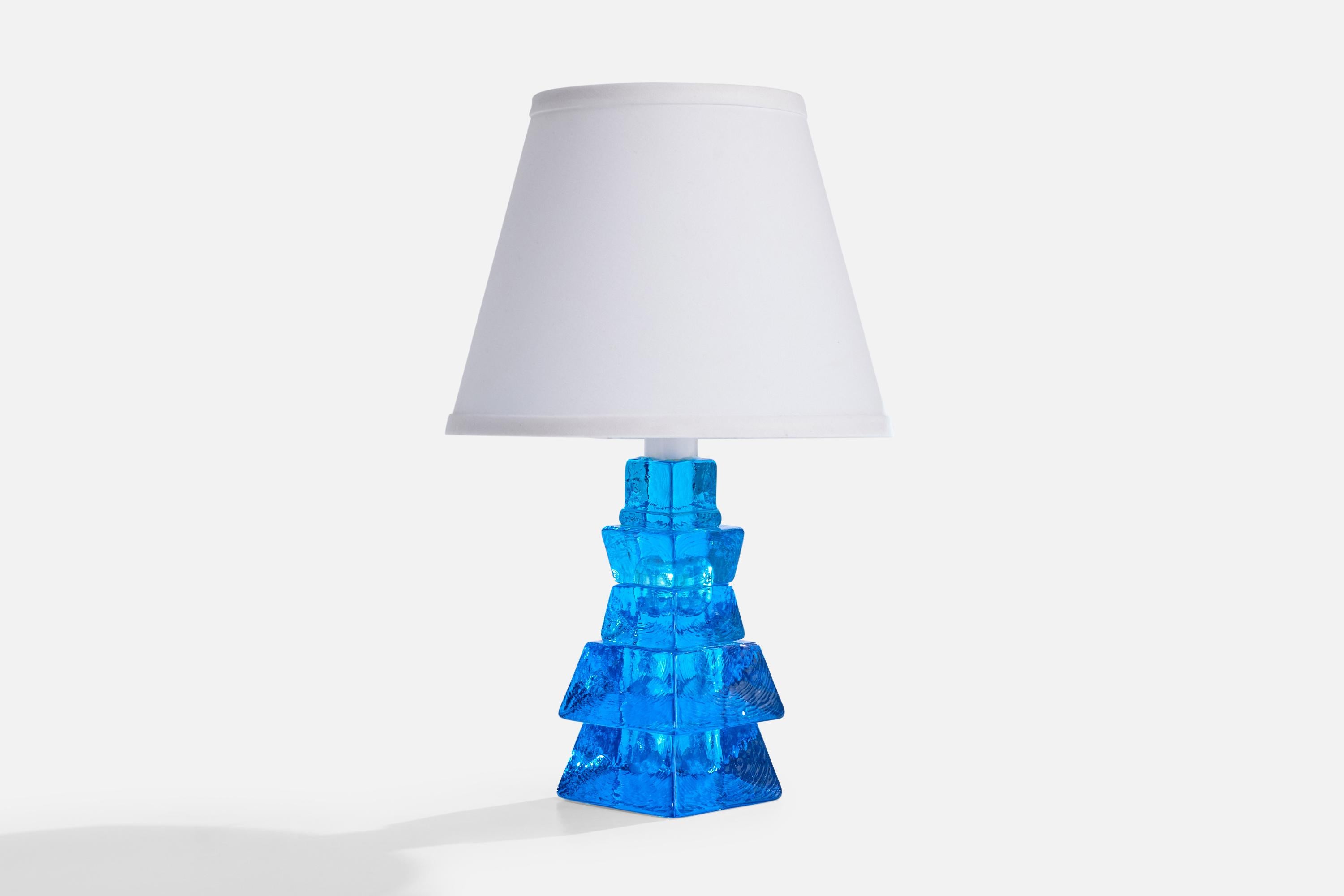 A blue-colored glass table lamp produced by Urshult Glasbruk, Sweden, c. 1960s.

Dimensions of Shade (inches): 6” Top Diameter x 10” Bottom Diameter x 8” Height

Dimensions of Lamp with Shade (inches): 16.5” Height x 10” Diameter

Dimensions of Lamp