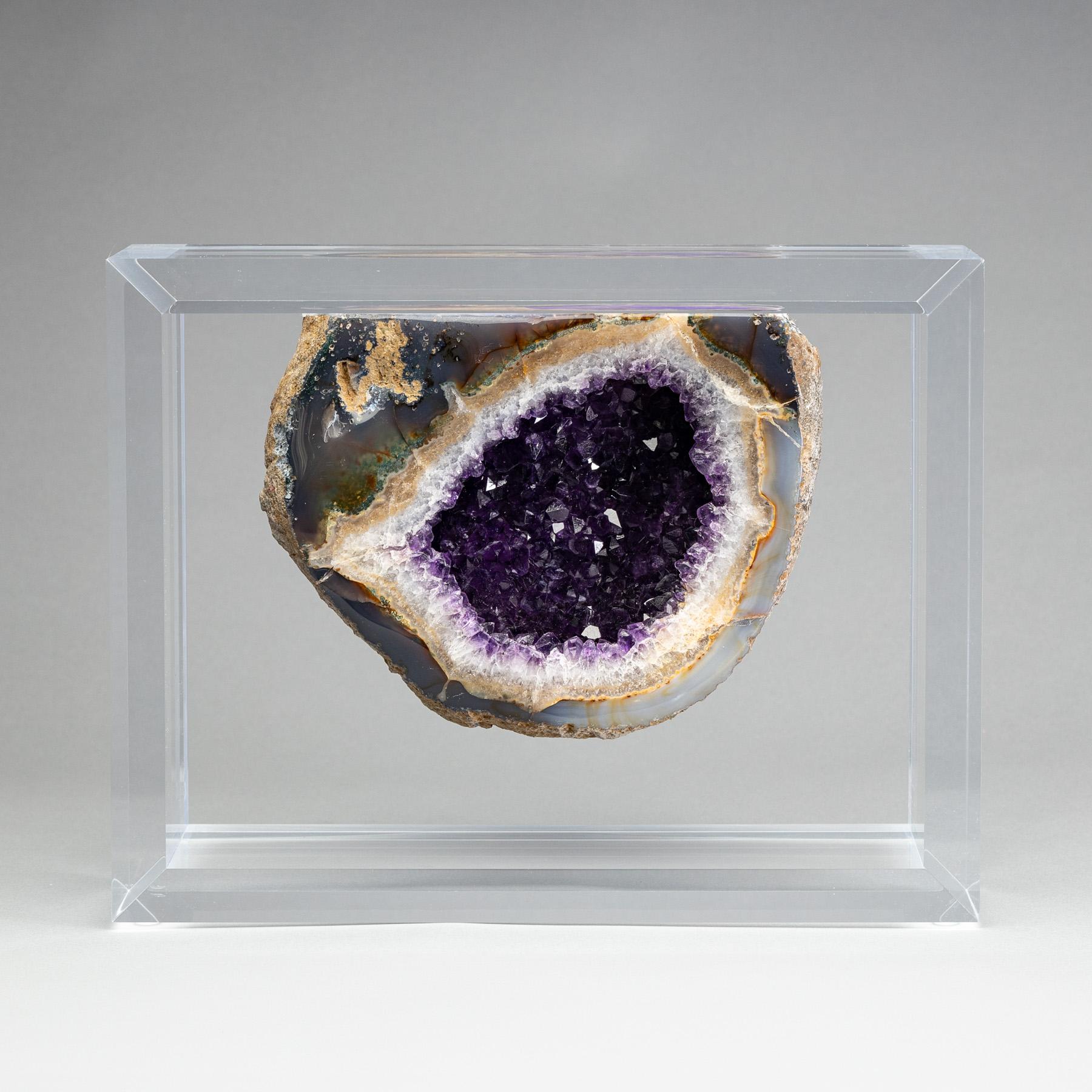 Beautiful Amethyst geode displayed in an original design in a acrylic box.- 
