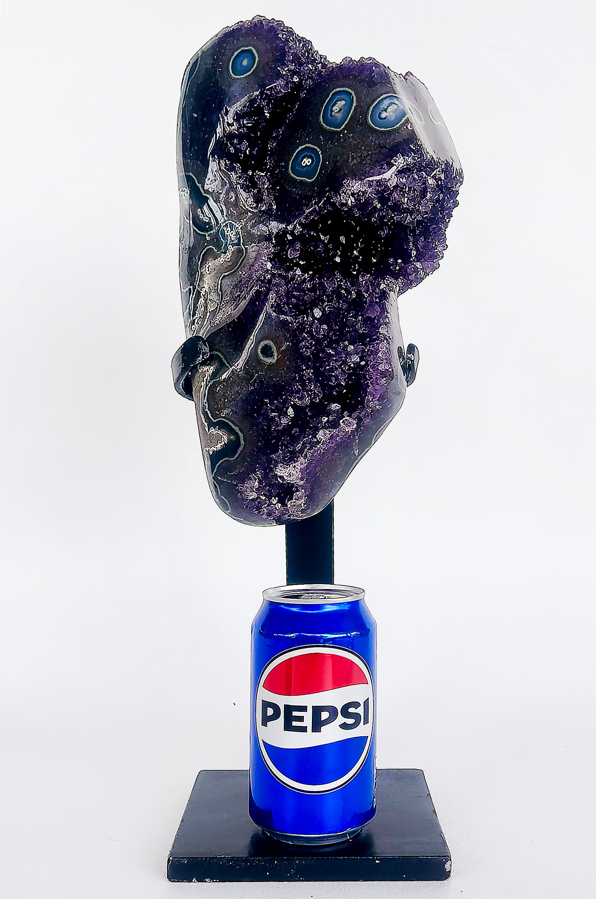 Uruguayan Amethyst Agate Eyes Geode,  Weighs 18 lbs. on Custom Made Stand

Offered for sale is an Uruguayan amethyst geode with agate eyes throughout. The geode weighs 18 lbs. and has been custom fitted stand.  The amethyst alone without the stand