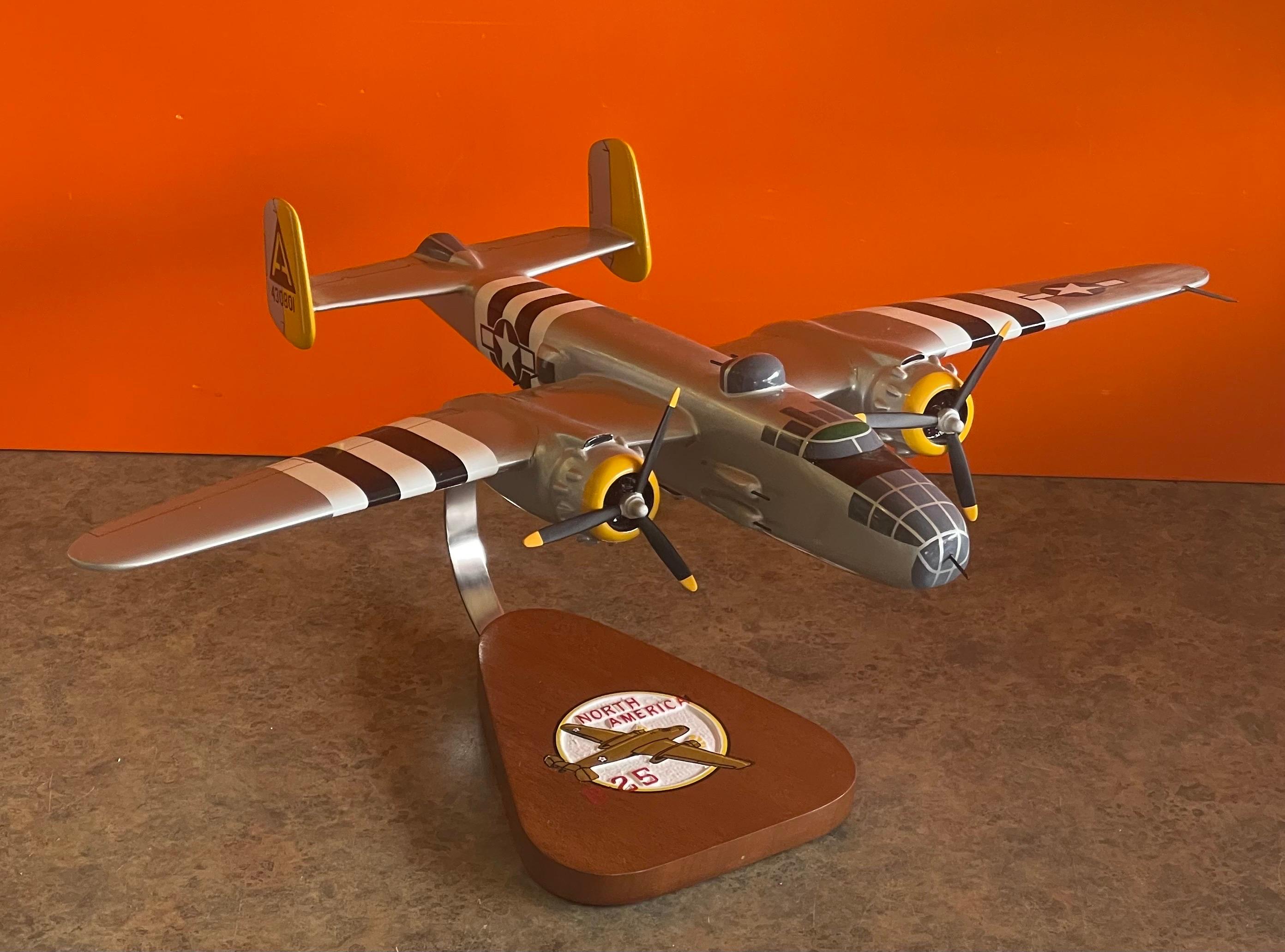 A very cool U.S.A.F. North American Aviation B-25 bomber / airplane solid wood contractor desk model by Pacific Aircraft , circa 1990s. The plane is the J Mitchell 