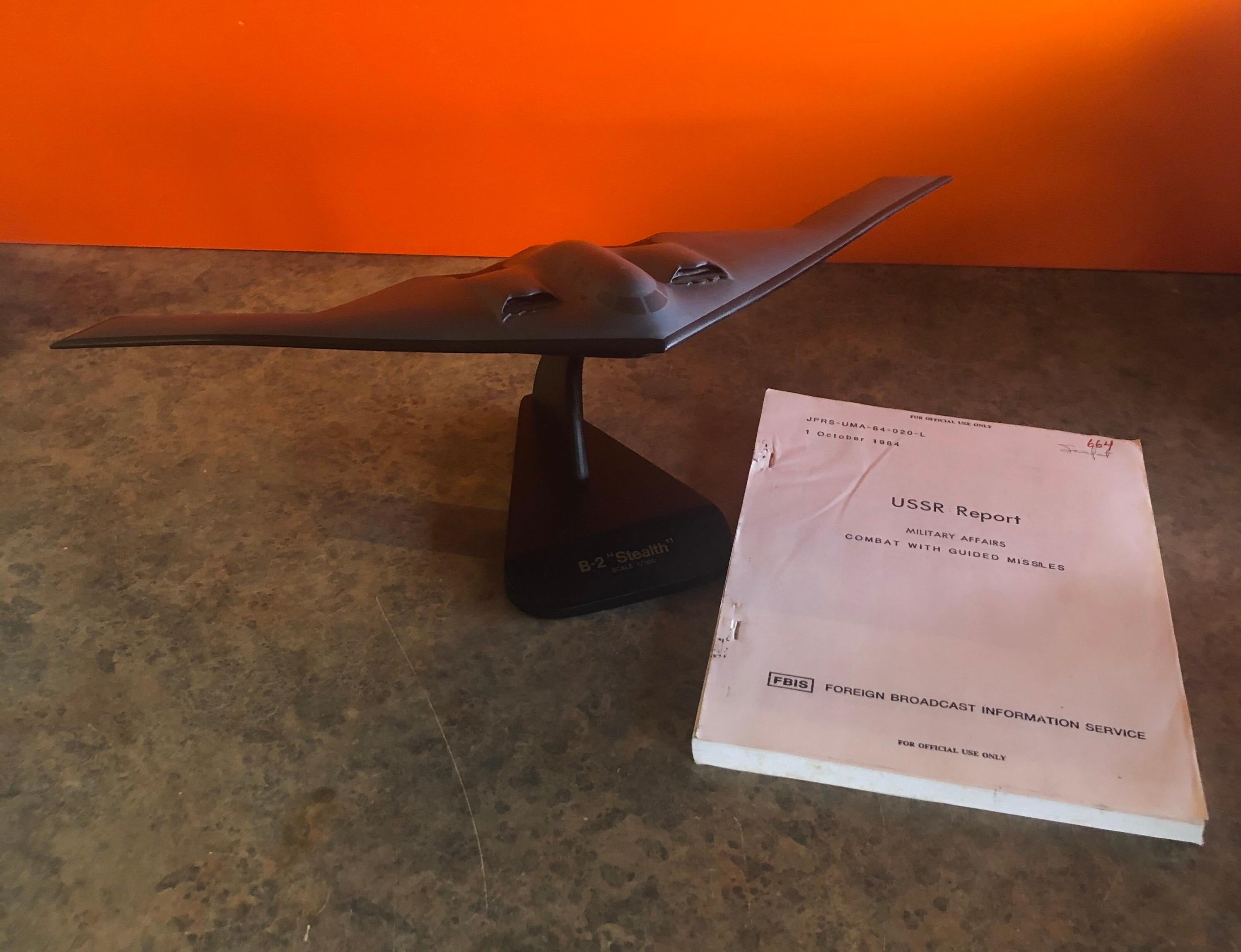 A very cool U.S. Air Force B2 Stealth airplane / bomber contractor desk model, circa late 1980s. The piece is in very good condition and super high quality. It is made of wood and mounted on a triangular wooden base; this is a very large desk model