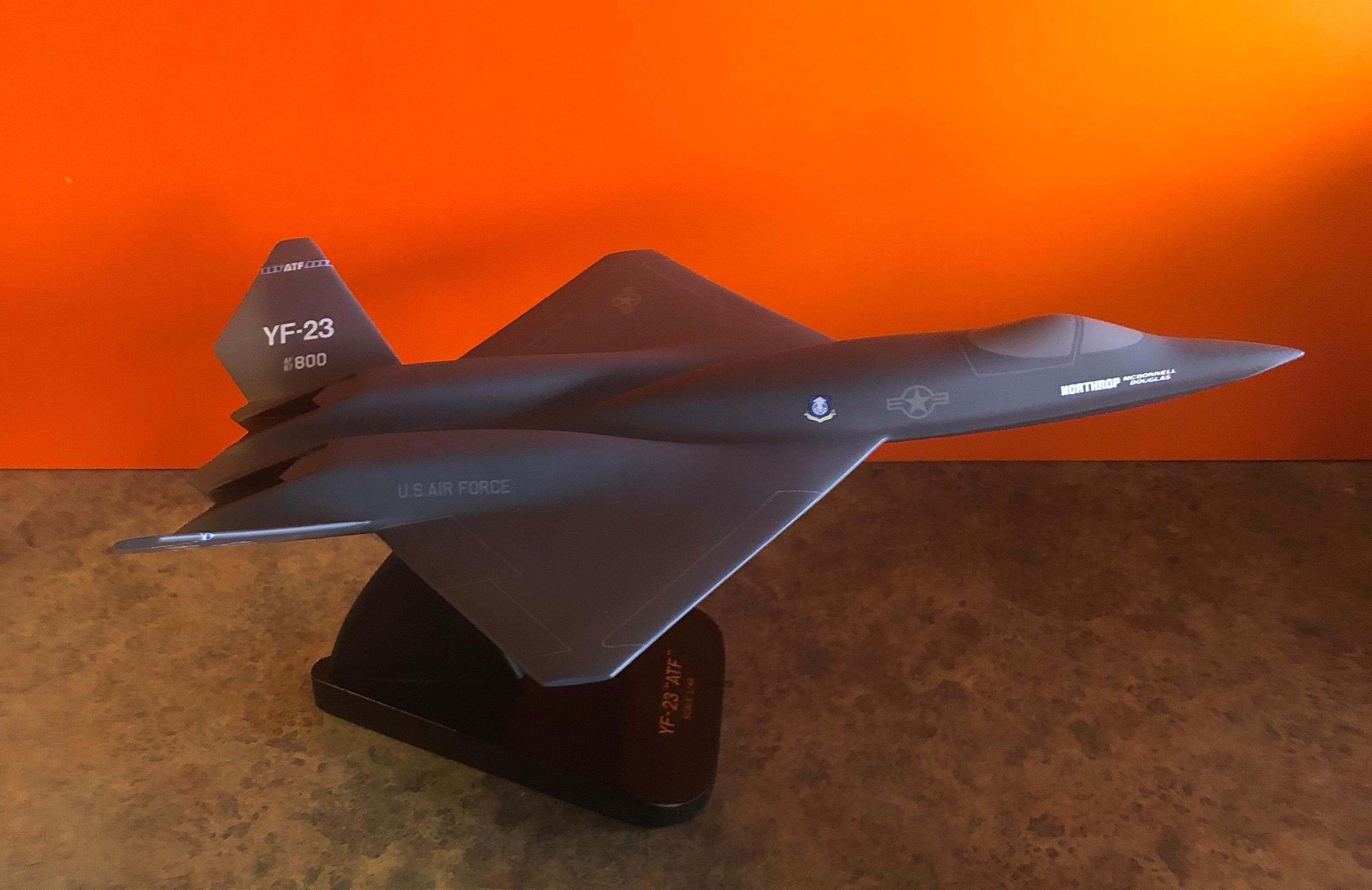 A very cool U.S. Air Force YF-23 Advanced Tactical Fighter (ATF) contractor desk model, circa late 1980s. The piece is in very good condition and super high quality. It is made of wood and mounted on a triangular wooden base; this is a very large