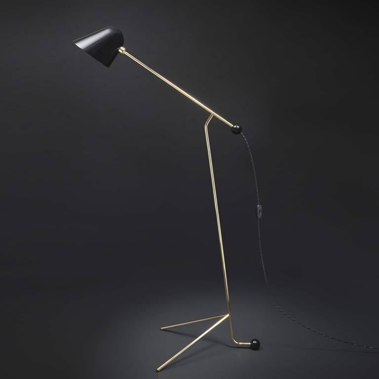 US 110v floor lamp with brass structure and glossy black diffuser, available from showroom display. 
Measures: 30.5