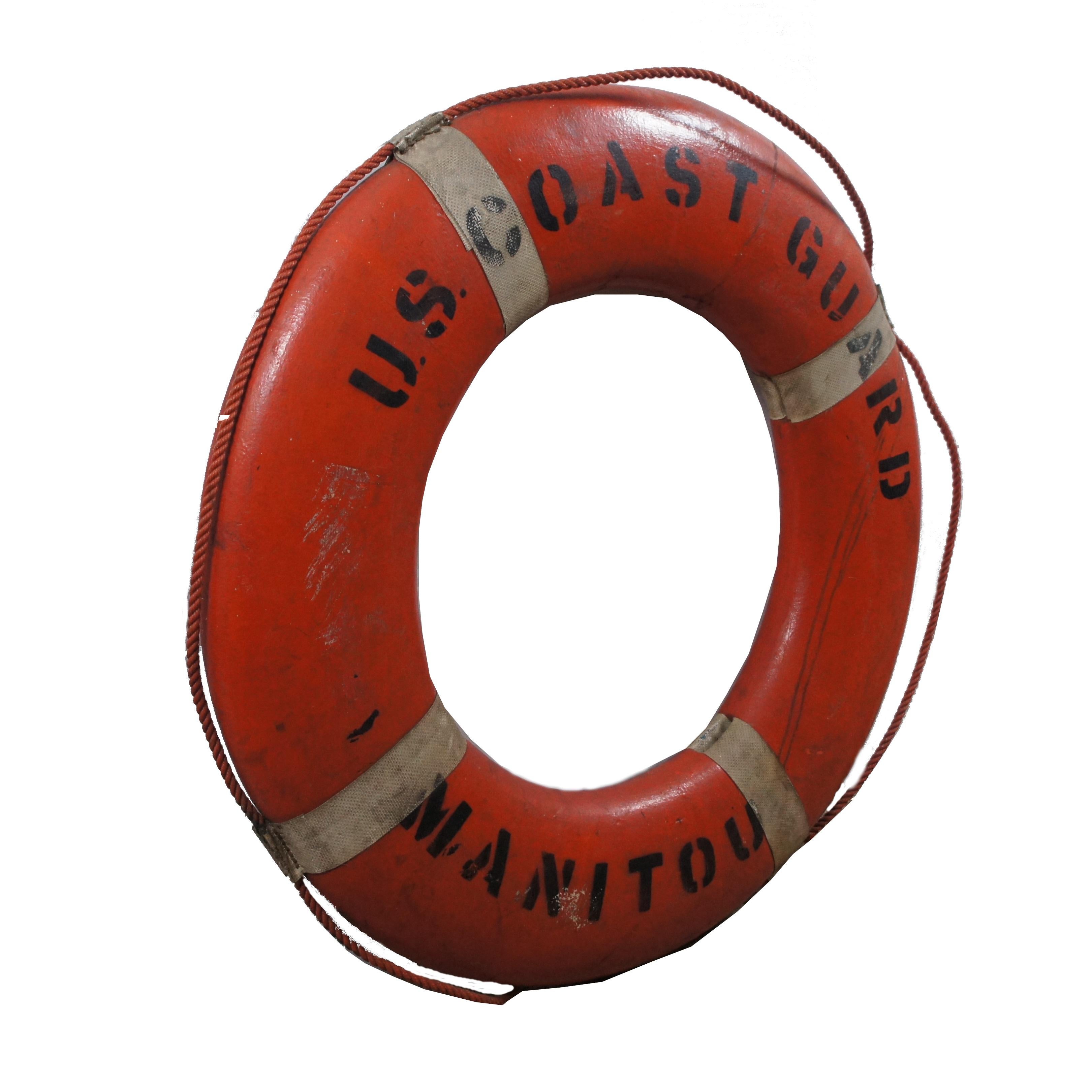 Mid century nautical maritime U.S. Coast Guard Manitou hard foam preserver buoy safety ring featuring an orange painted exterior with white straps and orange rope handles.

