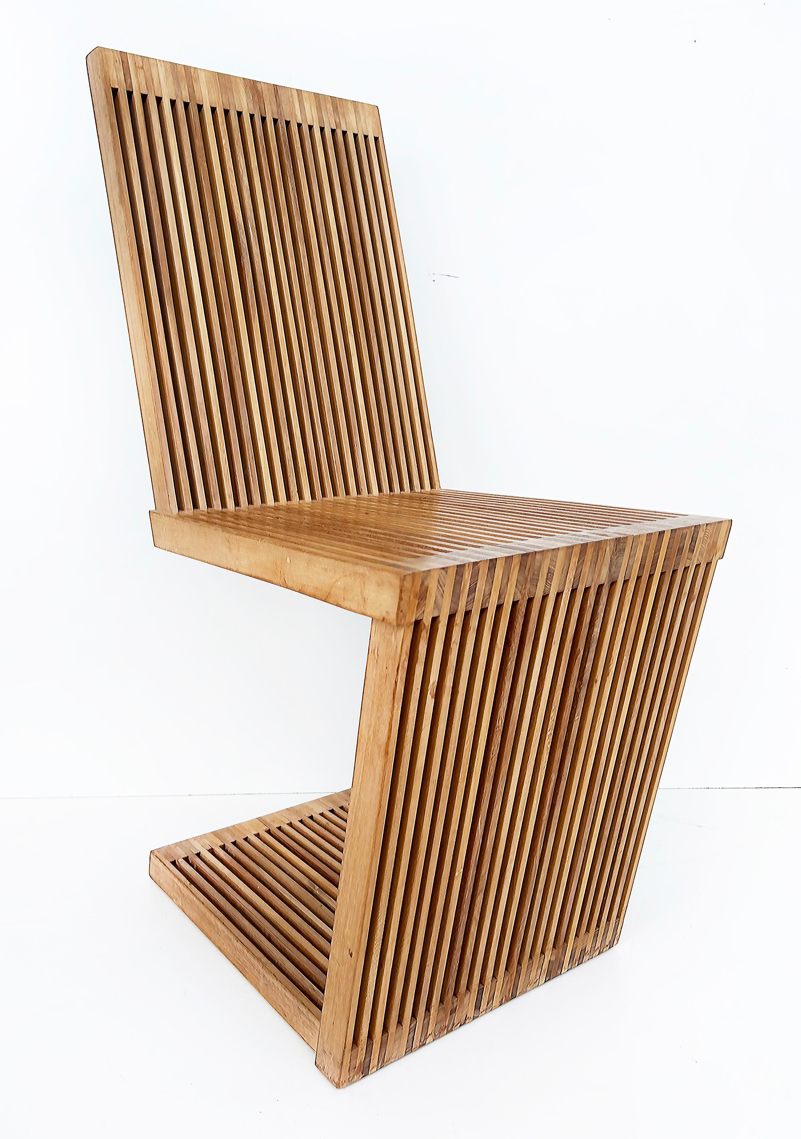 USA Slatted Wood Cantilevered Zig-Zag Dining Chairs, Set of 6

Offered for sale is a set of six slatted wood cantilevered dining chairs with meticulous and fine craftsmanship. These were acquired by the previous owner at a gallery in New York City