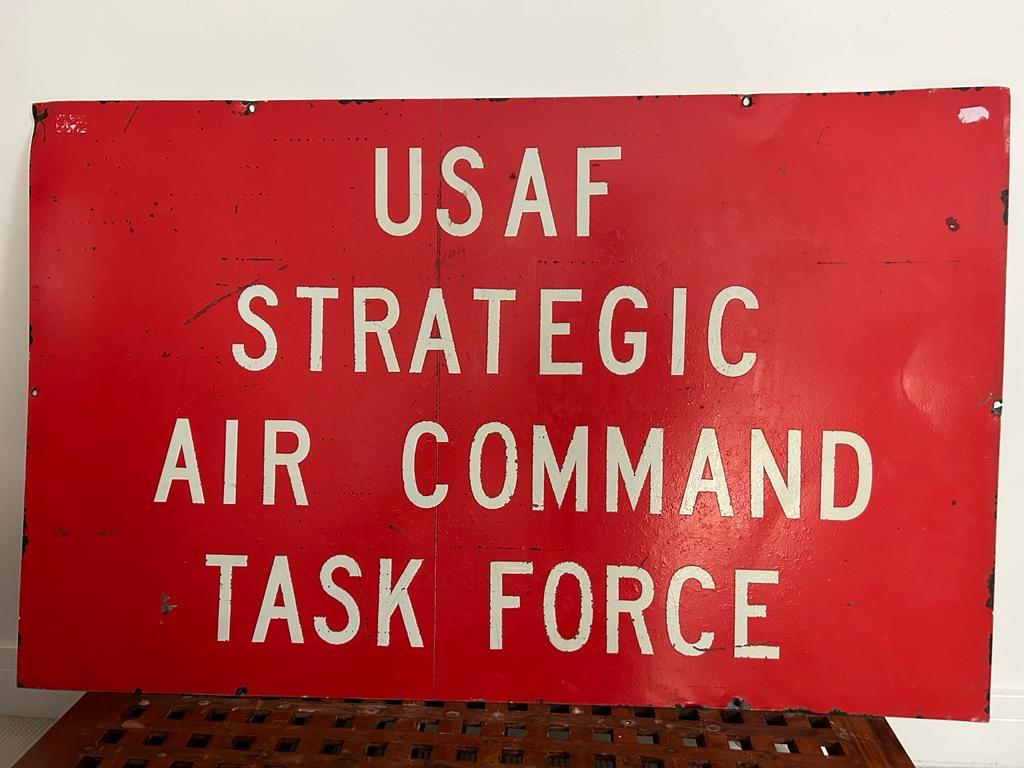 A very rare US Air force base metal sign, with reflective red paint and white reflective lettering to read 'USAF Strategic Air Command Task Force' with dimensions of 114cm by 71.5cm. We consider this sign was originally from one of the USAF air
