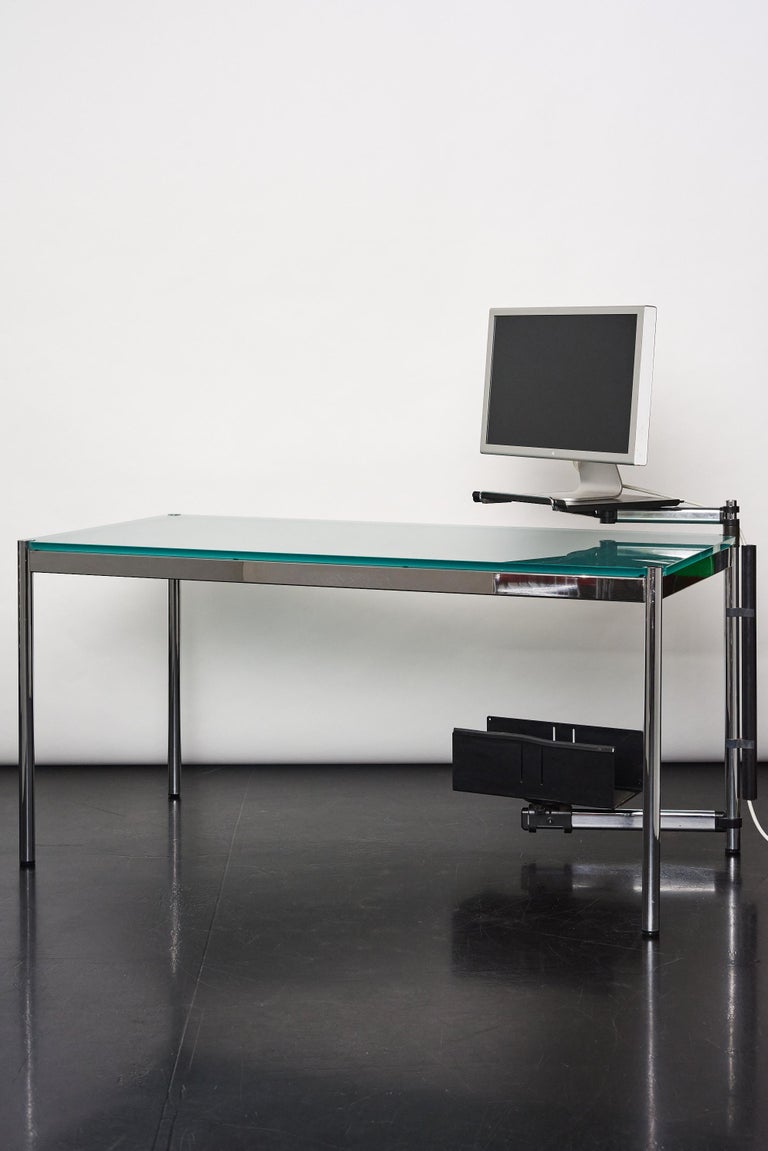 USM Haller table designed by Swiss architect Fritz Haller and Paul Schaerer in 1964
 A great modern, significant design piece that can be used as a dining table or an executive desk.
 
Minimal and elegant table with cable management accessories,