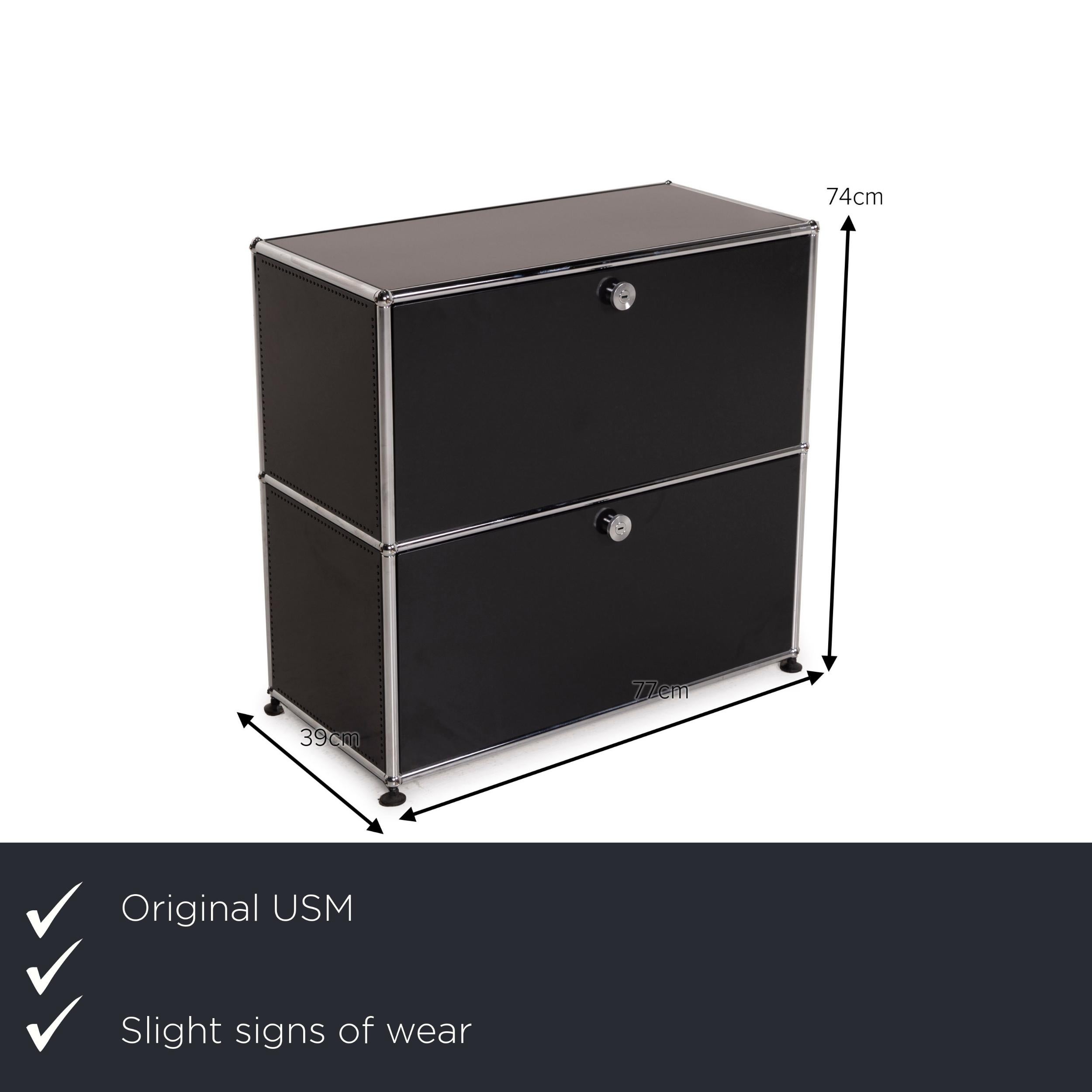 We present to you an USM Haller metal sideboard black 1x2 compartments office cabinet.
 
 

 Product measurements in centimeters:
 

Depth: 39
Width: 77
Height: 74
 
 
 
 
 