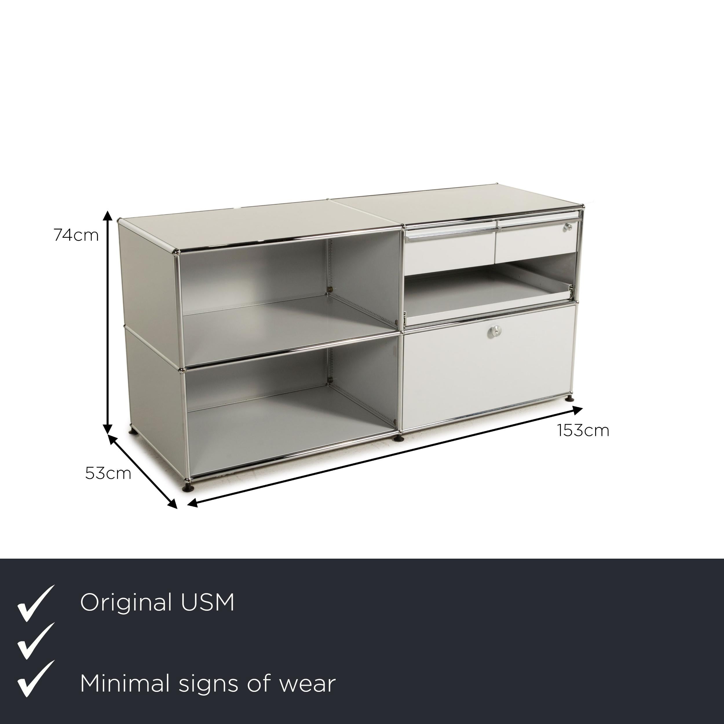 We present to you an Usm Haller metal sideboard gray light gray 2x2 incl. Drawer shelf office.

 

 Product measurements in centimeters:
 

 depth: 53
 width: 153
 height: 74.




 