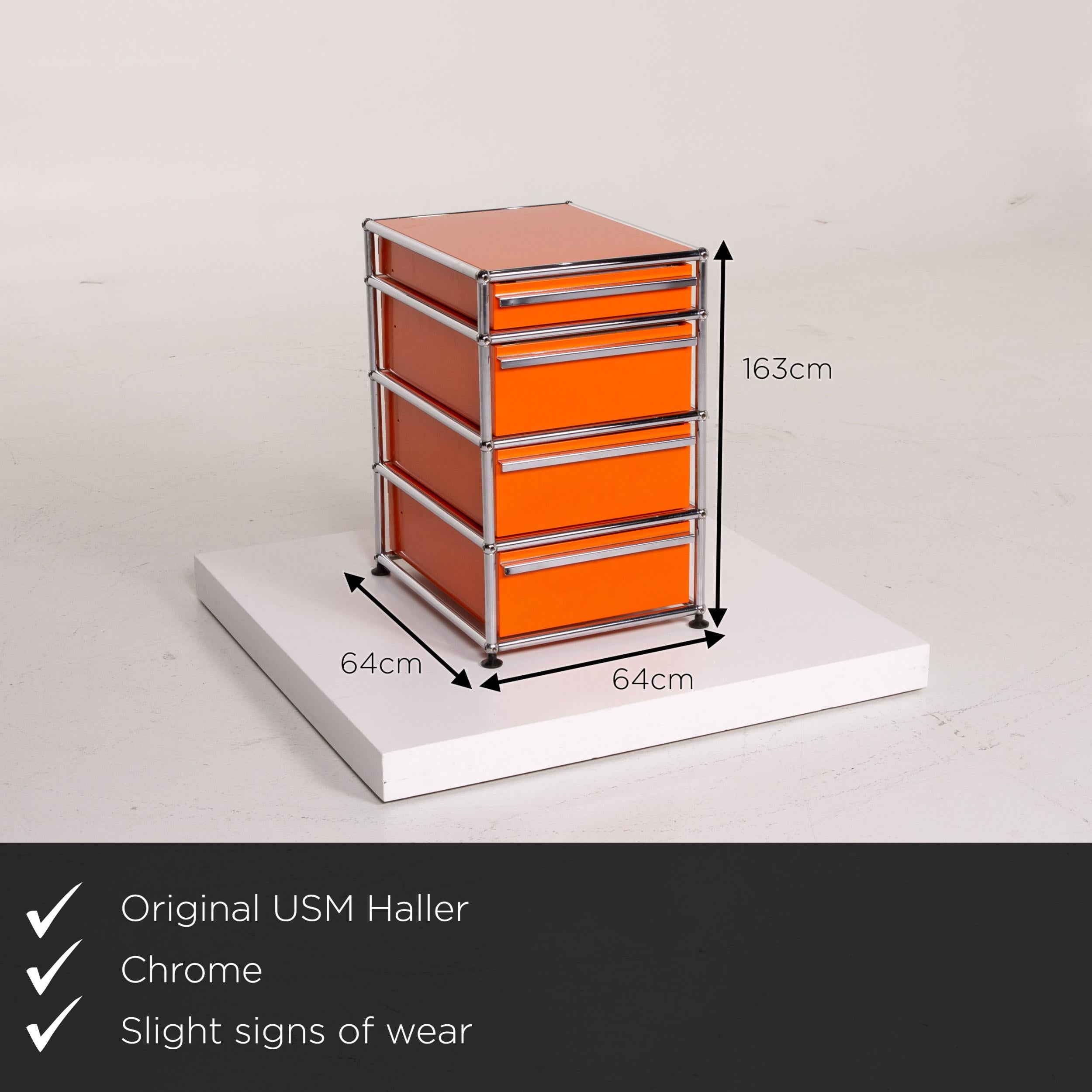 We present to you an USM Haller metal sideboard set orange container chrome office.


 Product measurements in centimeters:
 

 Depth 64
 Width 54
 Height 163.





 