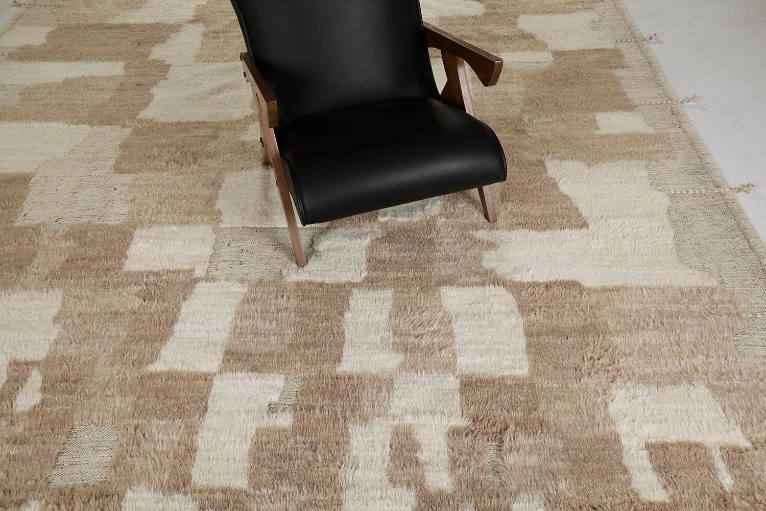 The Ussem rug is a pile woven wool piece inspired by Scandinavian design elements for the modern design world. The rug's shag balance and harmony, handwoven with playful shades of natural golden brown toned flat weave with unique piles of ivory.