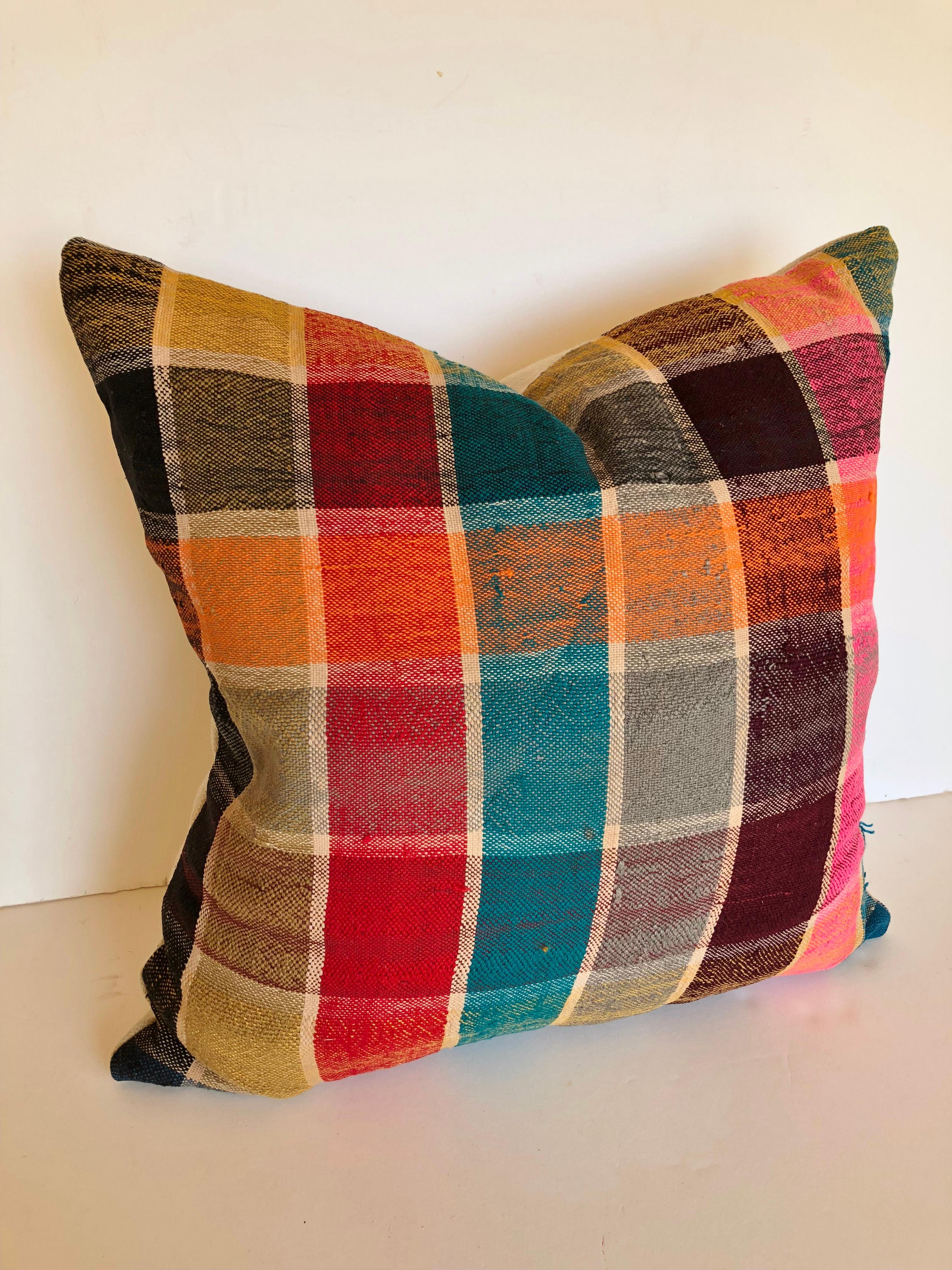 Custom pillow cut from a vintage Moroccan handwoven cotton haik or shawl from the Berber tribes living in the Middle Atlas mountains. Woven in the late 20th century, usually vivid plaid. Pillow is backed in a linen blend, filled with a mix of 50/50