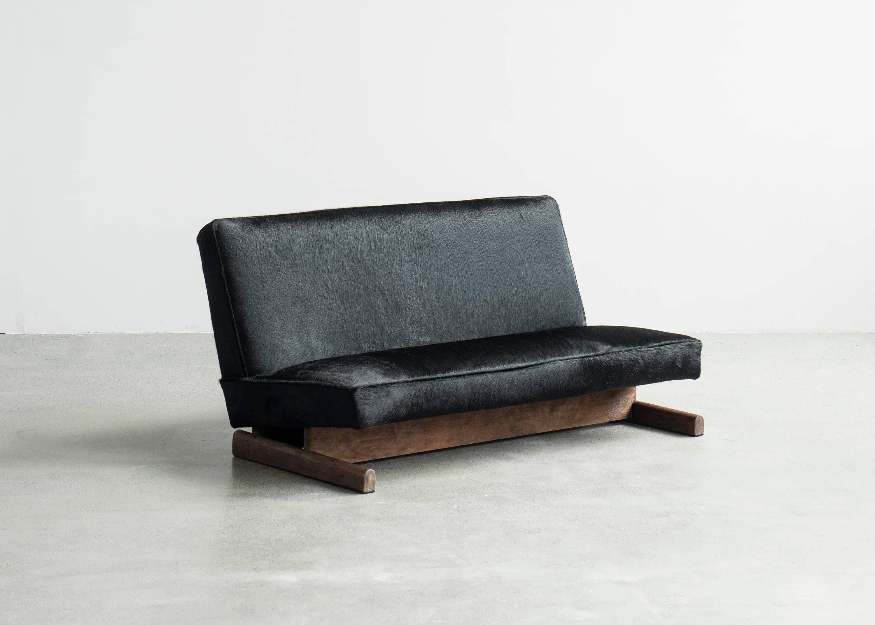 Ut 02 Sofa by Sing Chan 
Dimensions: W 76 x D 135 x H 67 cm
Materials: Cowhide, North American Black Walnut, waxing.

Sing Chan ( Chinese: 陈星宇/Xingyu Chen), the founder of SINGCHAN DESIGN, was born in 1990 and graduated from the Department of