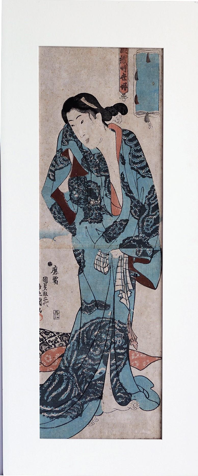  1844. Kakemono-e: 26 1/2 x 8 3/8. Series: Pairing beautiful Women with Kimono Fabrics. Appropriately mounted on black silk. Censor's seal: Yoshimura. Publisher: Aritaya Kiyoemon.Signed Oju Kunisada (By Kunisada). 

Housed in a  31 3/4 x 13 3/4-inch