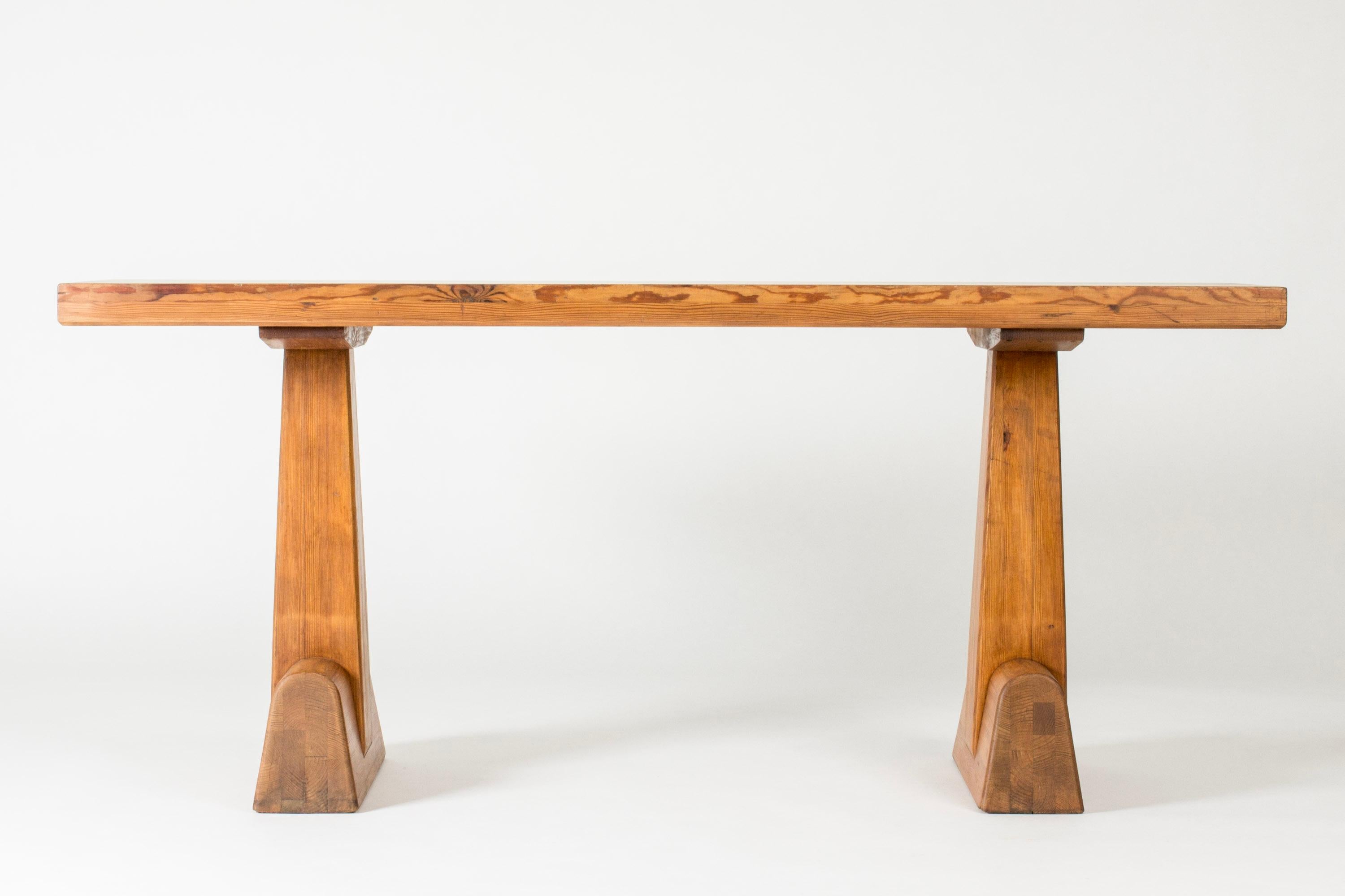 Iconic “Utö” dining table by Axel Einar Hjorth, made from solid pine in a striking, rustic design with beautiful woodgrain.

“Utö” is one of the series of furniture included in NK:s “Sporstugemöbler”, “sports cabin’s furniture”. Axel Einar Hjorth