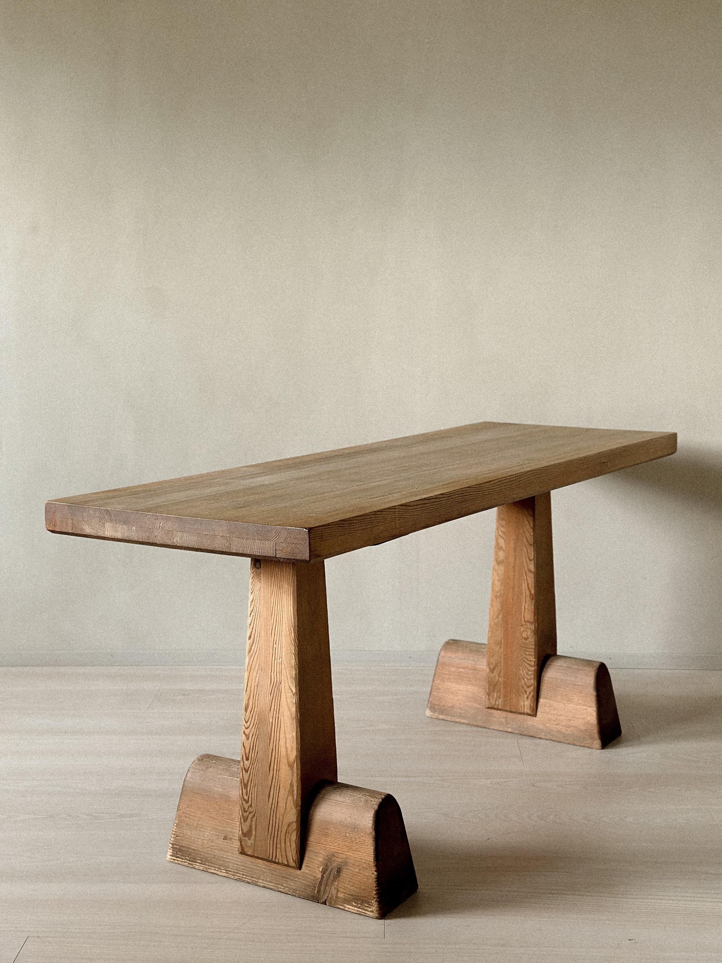 Rare and authentic Utö library table designed by Axel Einar Hjorth, manufactured by Nordiska Kompaniet, Sweden, 1932. Wear consistent with age and use, including surface scratches, marks, and minor chipping to the top.
