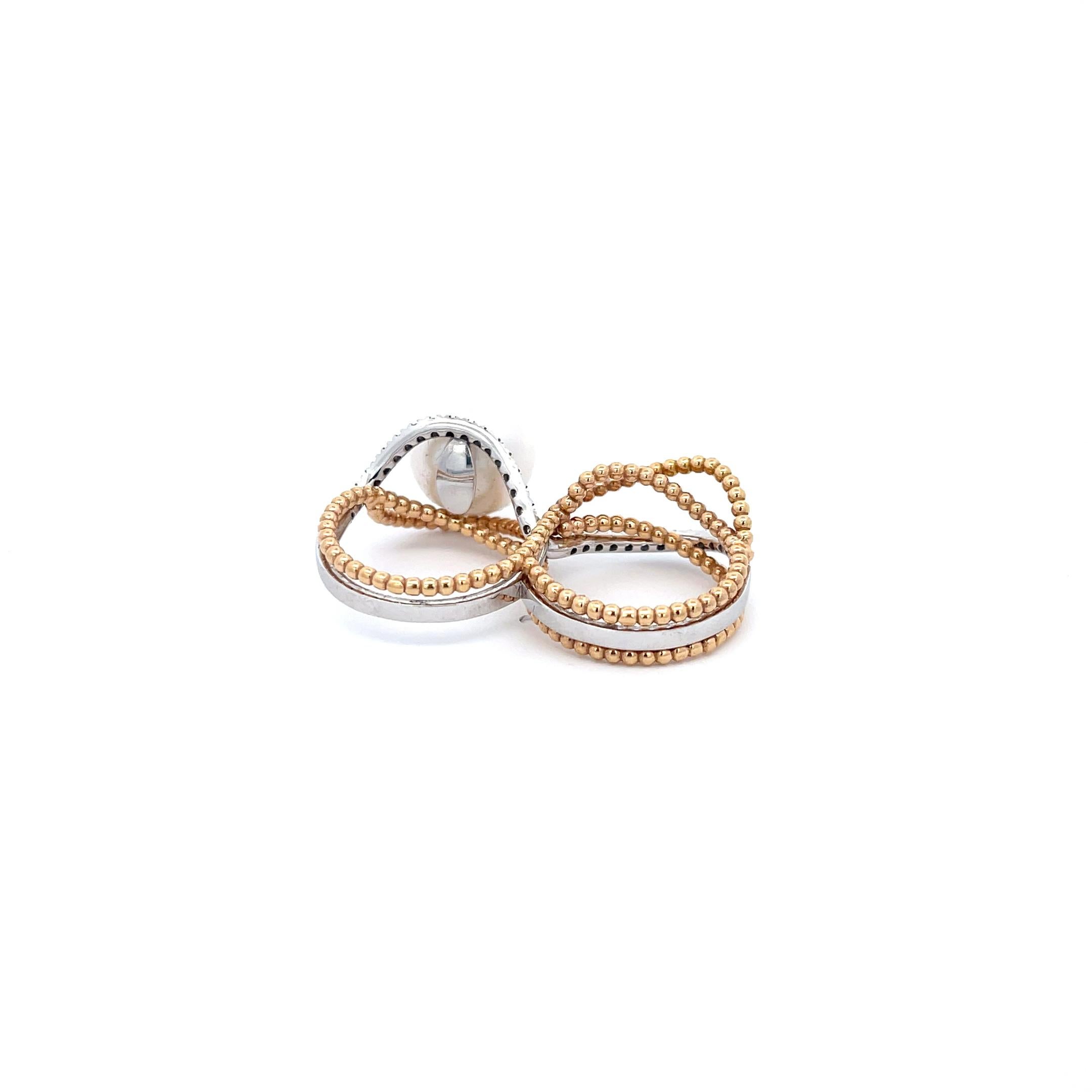 Utopia Doppelfinger-Birnen- und Diamantring aus 18 Karat Weiß- und Gelbgold. Fingergröße 6 & 6.5
13mm Weiße Perle  
14,79 Gramm