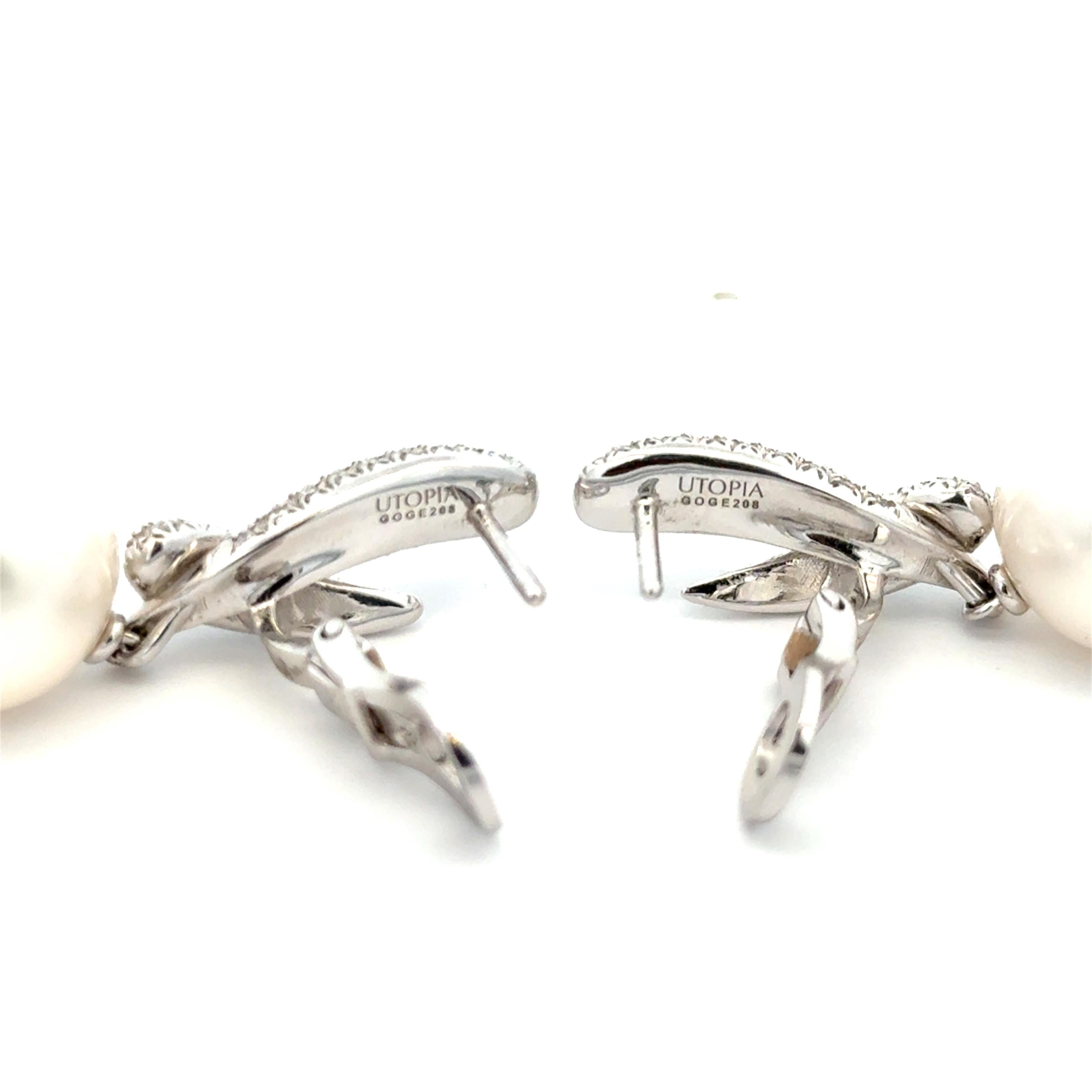 Utopia Freshwater Pearl & Diamond Earrings in 18K White Gold. The earrings feature two freshwater pearls that are approximately 13.5mm in size, accented by approximately 1.15ctw of brilliant round diamonds. The earrings are 1.5 inches in length and