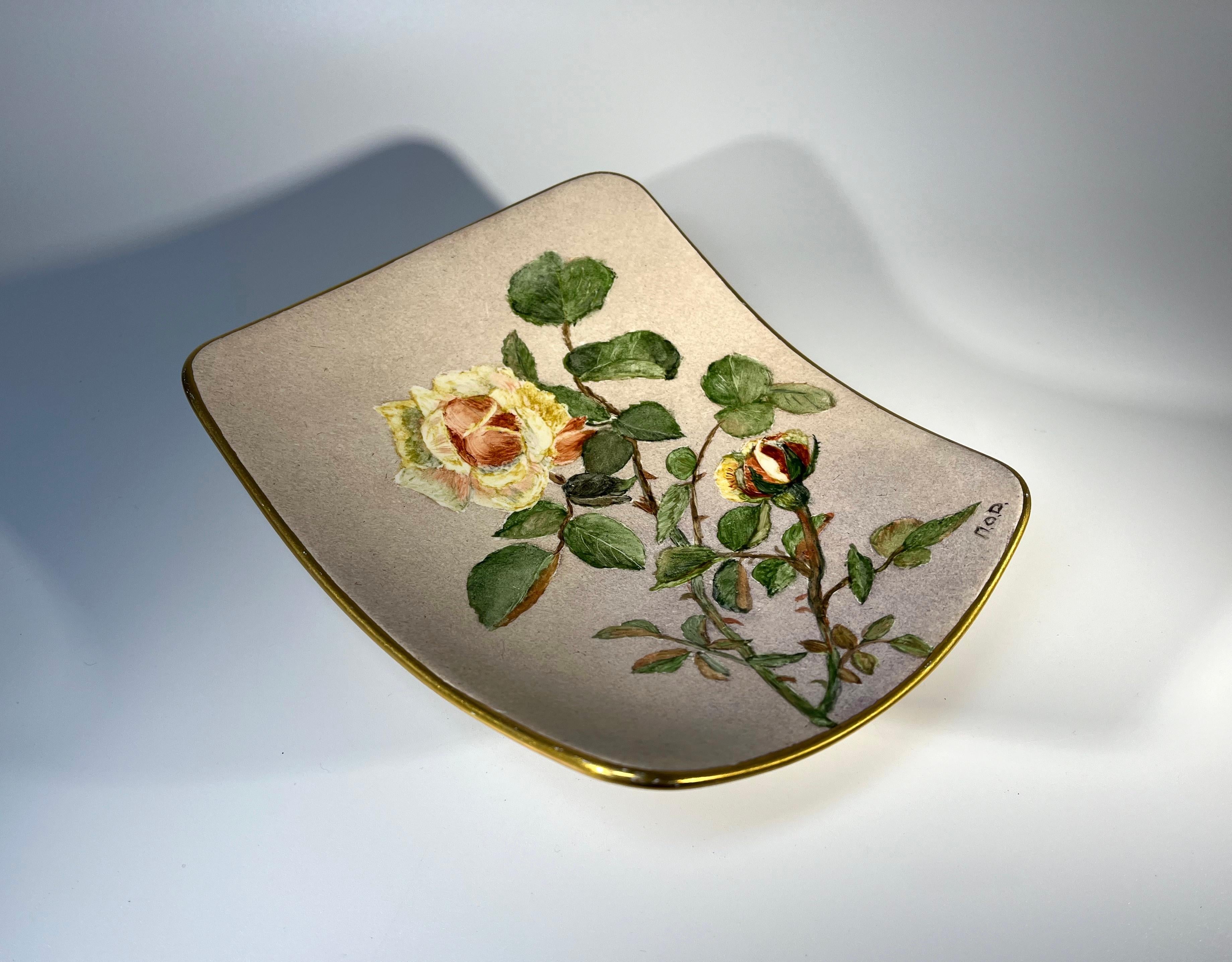 Effortlessly feminine ceramic tripod dish or vide poche, hand decorated with a beautiful detailed rose sprig
Stands on three gilded feet with gilded band to rim
Background is a warm matt oatmeal hue
Circa 1970's
Signed MOD
Height 2 inch, Width 5.5