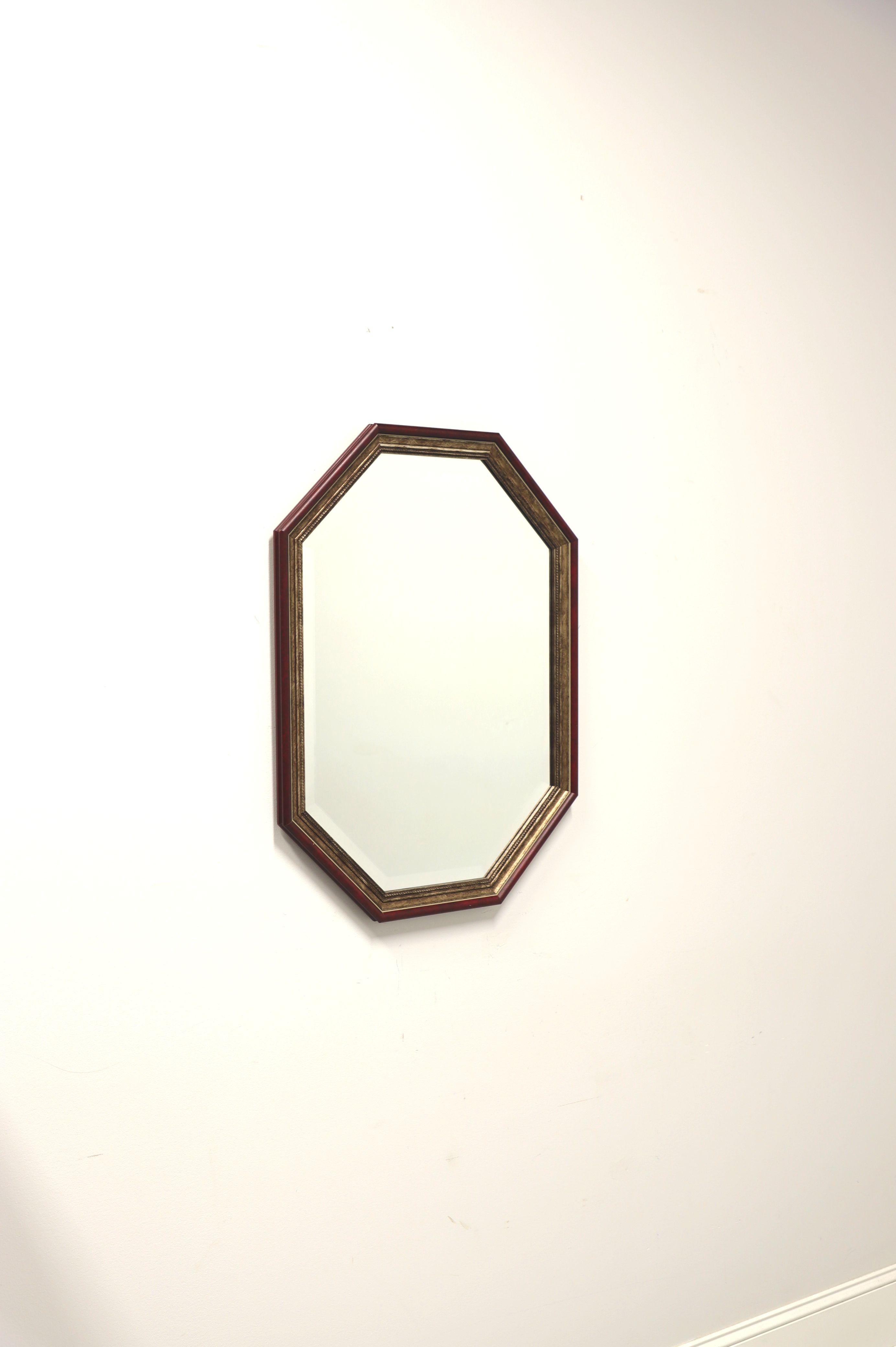 A Traditional style wall mirror by Uttermost, their 