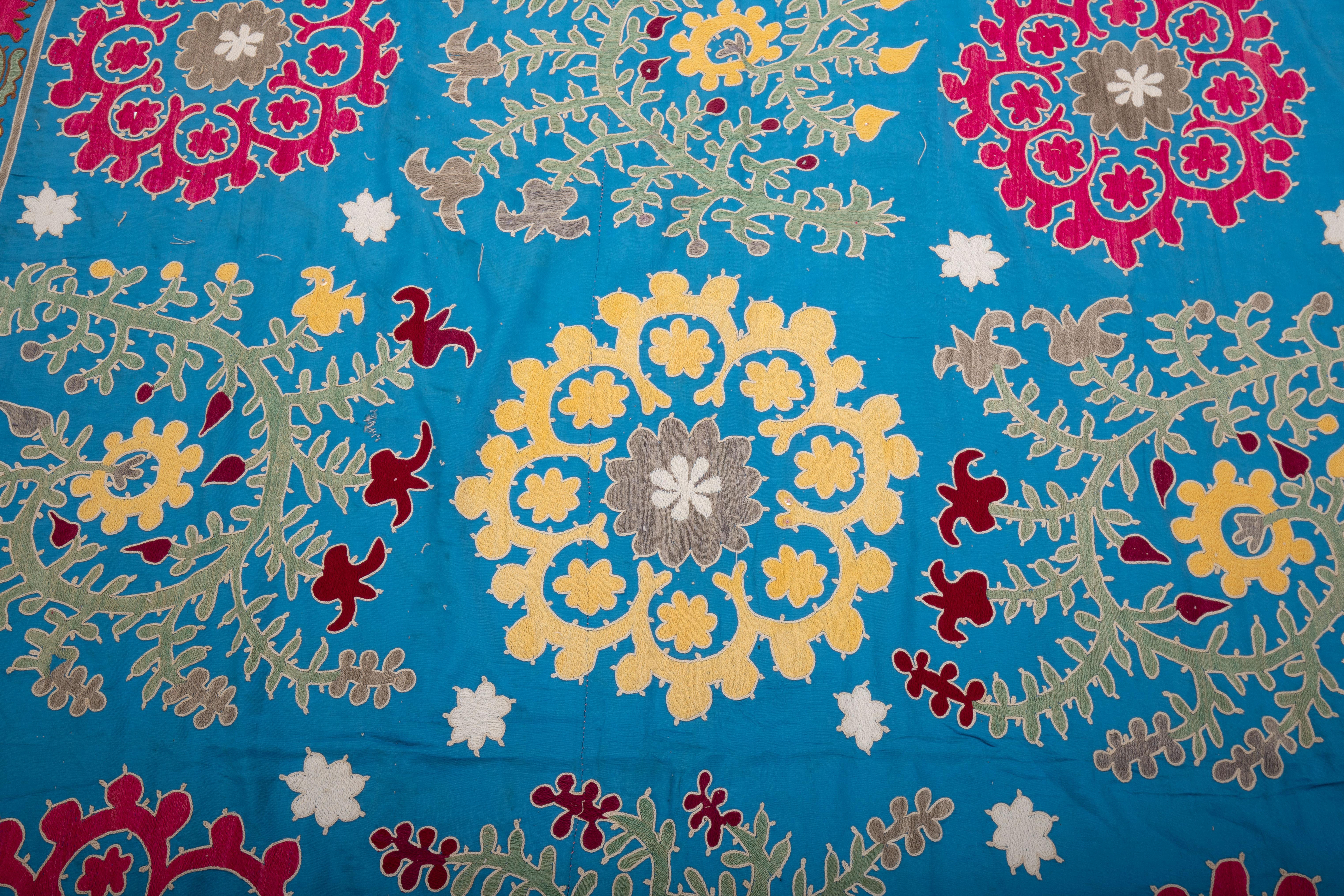 20th Century Uzbek Blue Suzani, cotton on Rayon background fabric, mid 20th C. For Sale