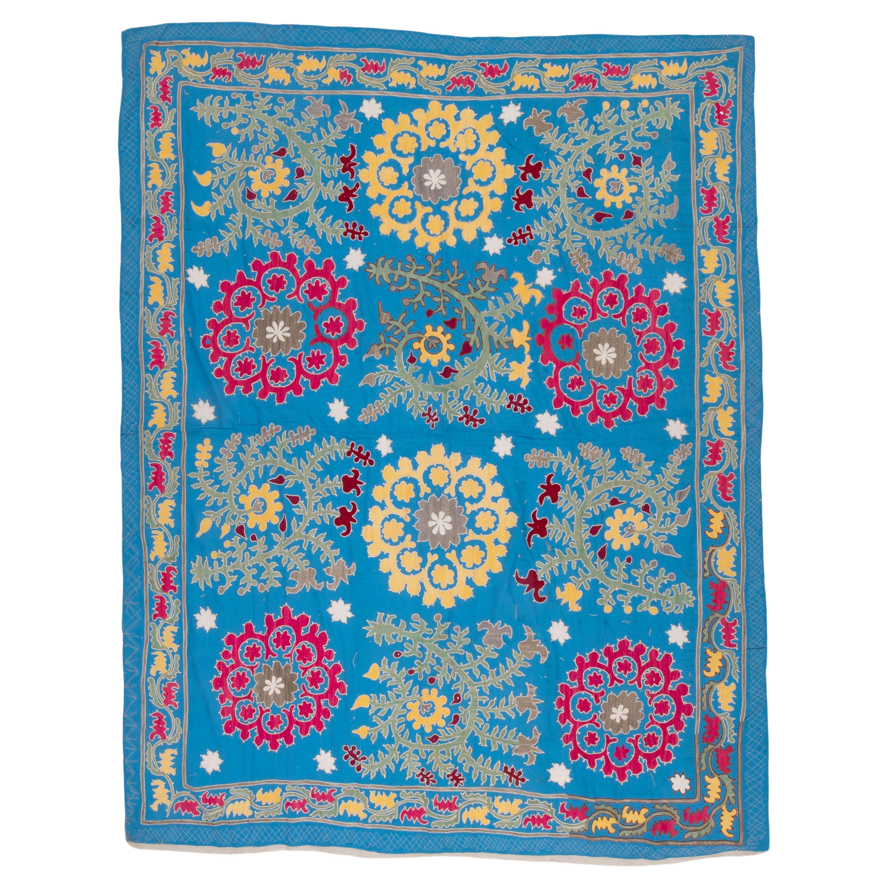 Uzbek Blue Suzani, cotton on Rayon background fabric, mid 20th C. For Sale