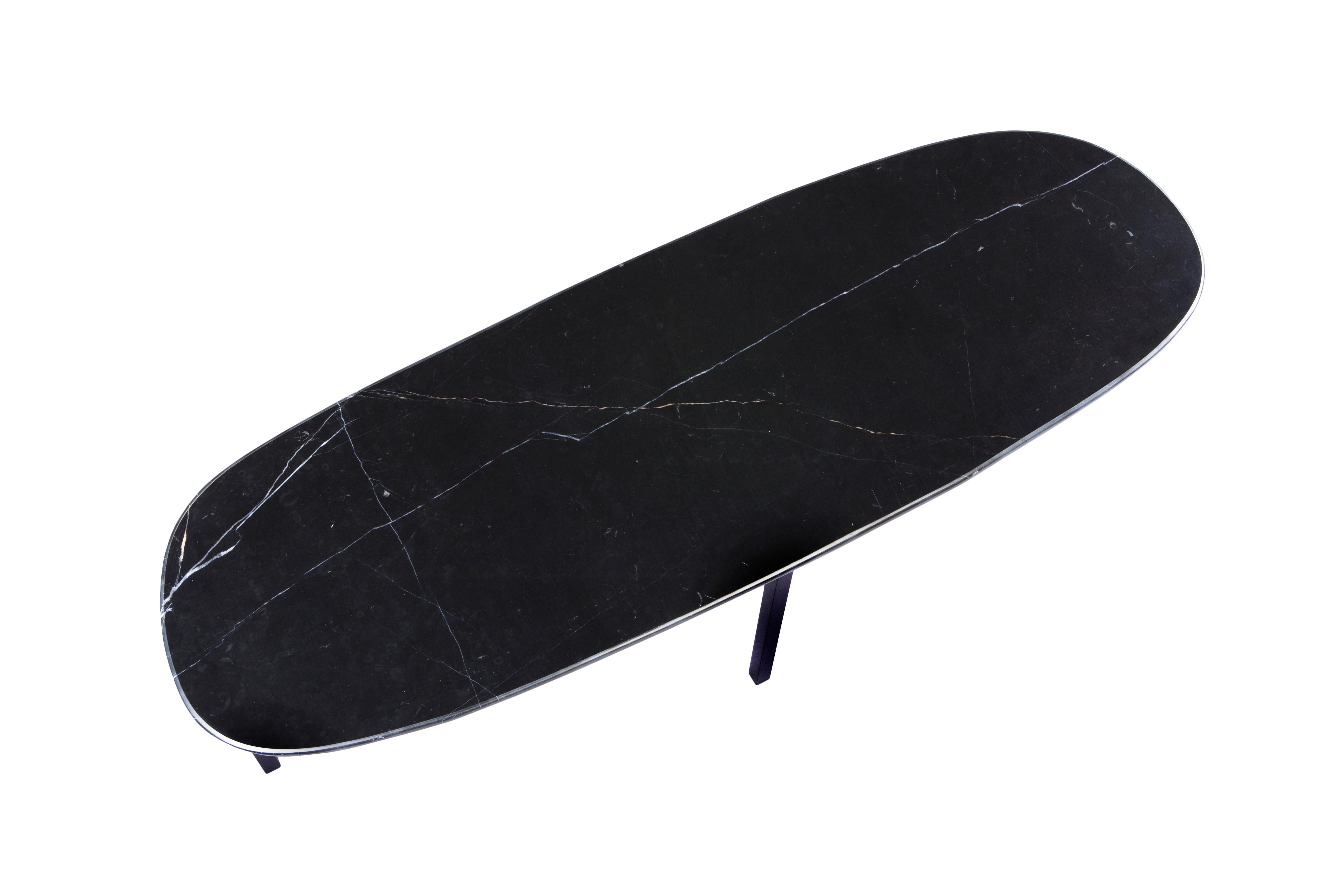 Uzun Tas coffee table by Rectangle Studio
Dimensions: W 120 x D 40 x H 43 cm 
Materials: Black marble, black paint coating on metal

Tas_Uzun Sehpa was shaped and finished by the marble table designer.
For this reason, each table has different