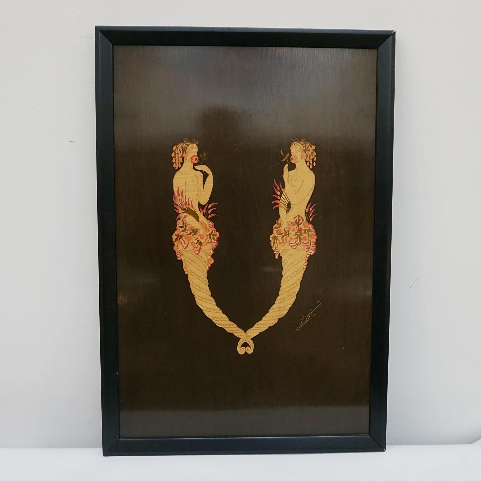 'V' by Erté (Romain de Tirtoff) as part of the alphabet series. A marquetry panel depicting two mermaids intertwined to form the letter 'V'. The marquetry work was undertaken by Georges Vriz around 1977. Sevenarts edition. Signed 'Erte' to lower