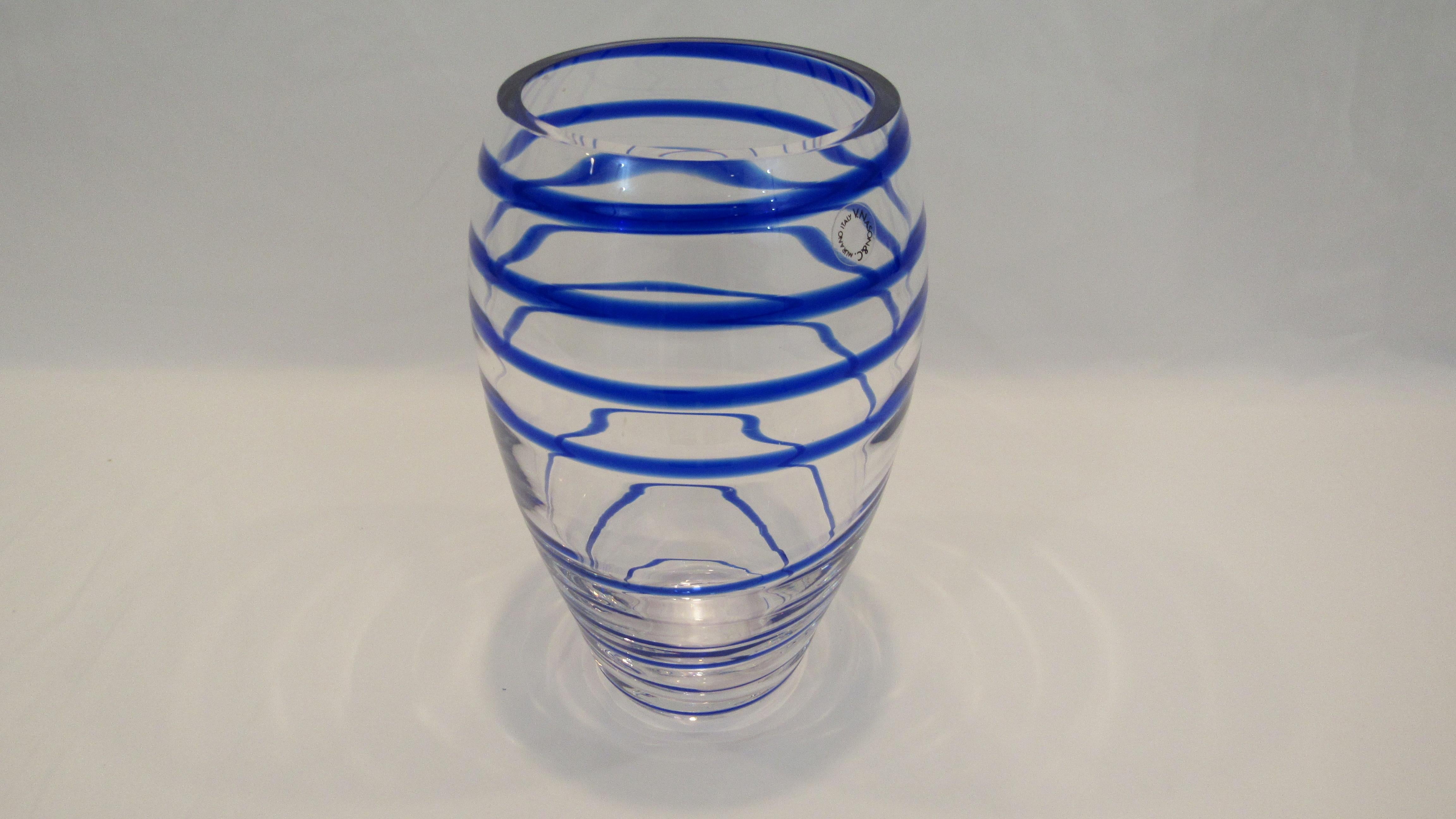 V. Nason & C. Italian Murano glass vase with blue spiral stripe offered for sale is an Italian blue spiral stripe Murano glass vase by V. Nason & C. This mouth-blown glass vase is created in a transparent and blue spiral color and retains the