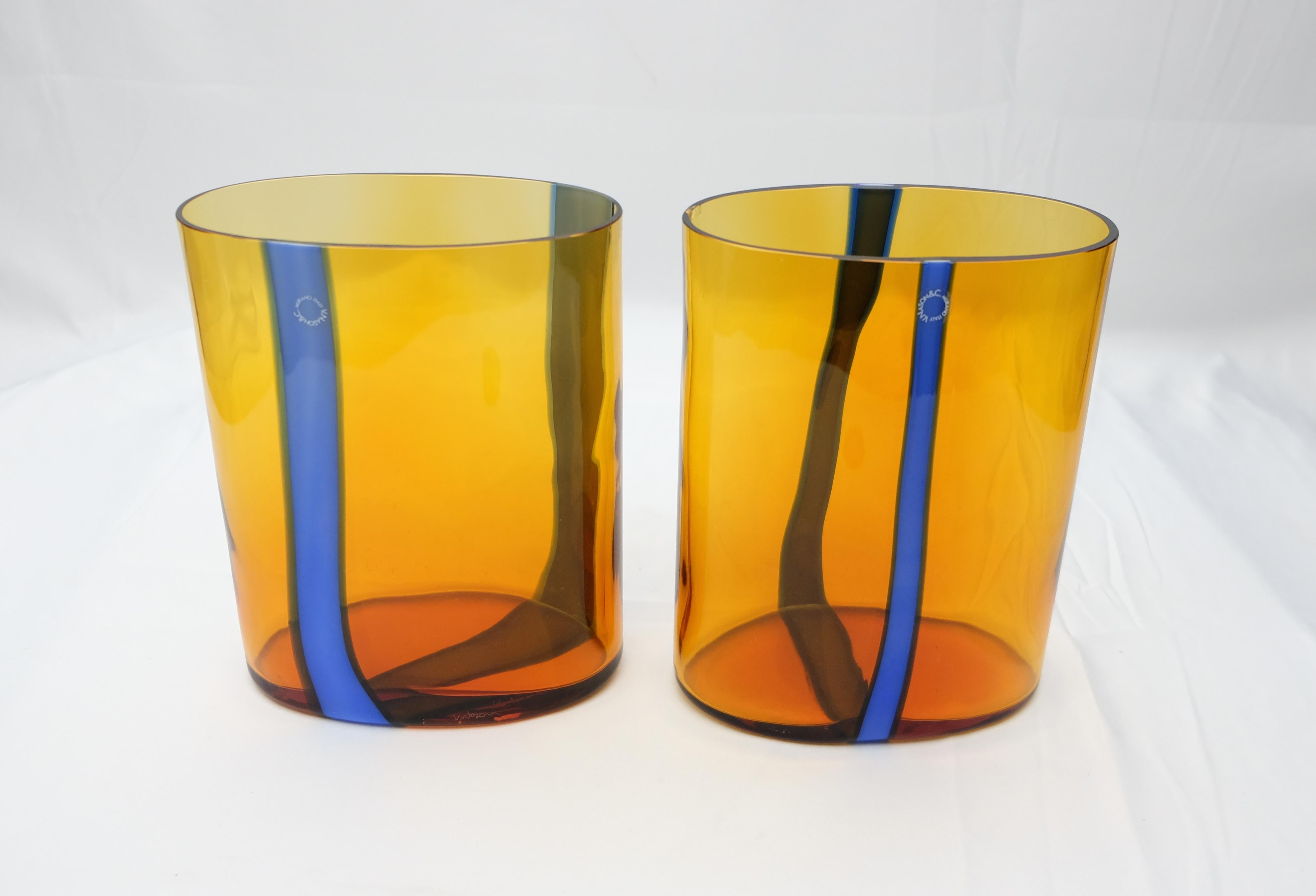 Offered for sale is a two-piece amber and blue Murano glass vases set by V. Nason & C. of Italy. The vases retain the maker's labels. Vincenzo Nason established his glassworks, Vincenzo Nason & Co. (VNC) on the island of Murano, Venice, Italy in