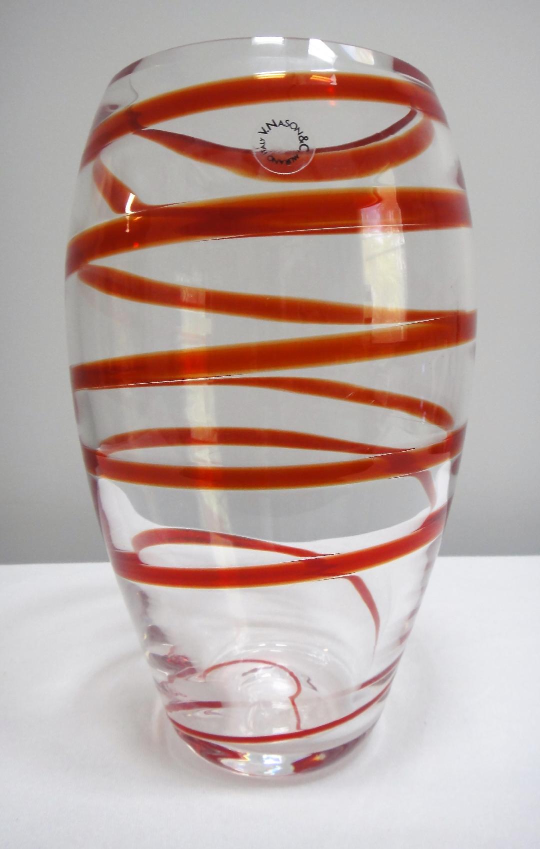 V. Nasson & C. Murano Art Glass Vase with Red Spiral Stripes Offered for sale is a swirled Italian art glass vase by V. Nasson & C. Vincenzo Nason established his glassworks, Vincenzo Nason & Cie (VNC) on the island of Murano, Venice, Italy in 1967,