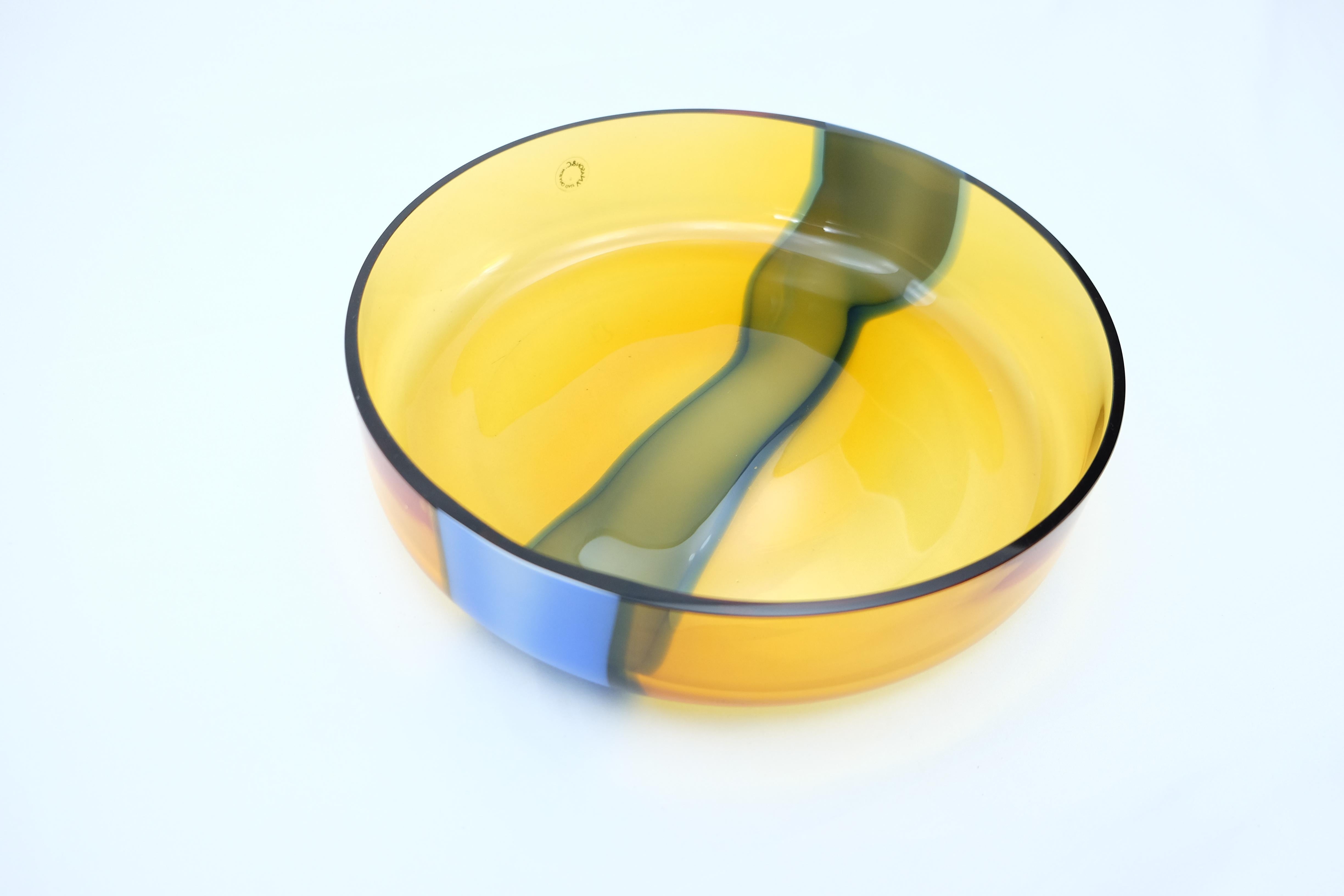 Offered for sale is a new unused yellow and blue Murano glass bowl by V. Nasson & Co. Vincenzo Nason established his glassworks, Vincenzo Nason & Cie (VNC) on the island of Murano, Venice, Italy in 1967, after having previously worked at Venini. The