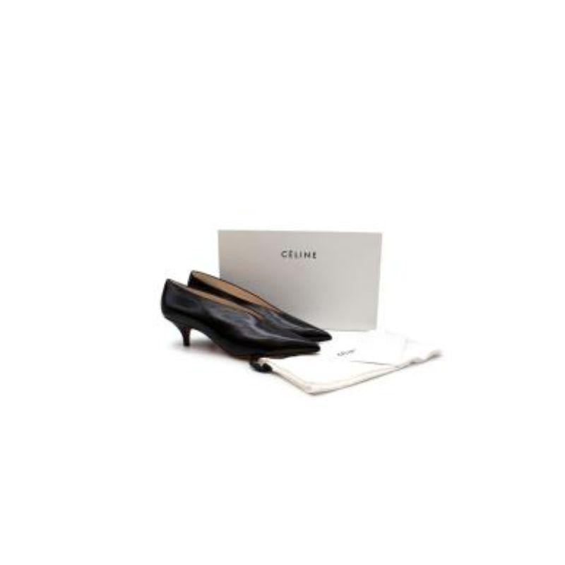 Celine V-Neck Pump 50
 
 
 
 -Kitten heels 
 
 -Branded leather insoles 
 
 -Slip on 
 
 -V opening 
 
 -Pointed toe 
 
 
 
 Material: 
 
 
 
 Leather 
 
 
 
 Made in Italy 
 
 
 
 PLEASE NOTE, THESE ITEMS ARE PRE-OWNED AND MAY SHOW SIGNS OF BEING