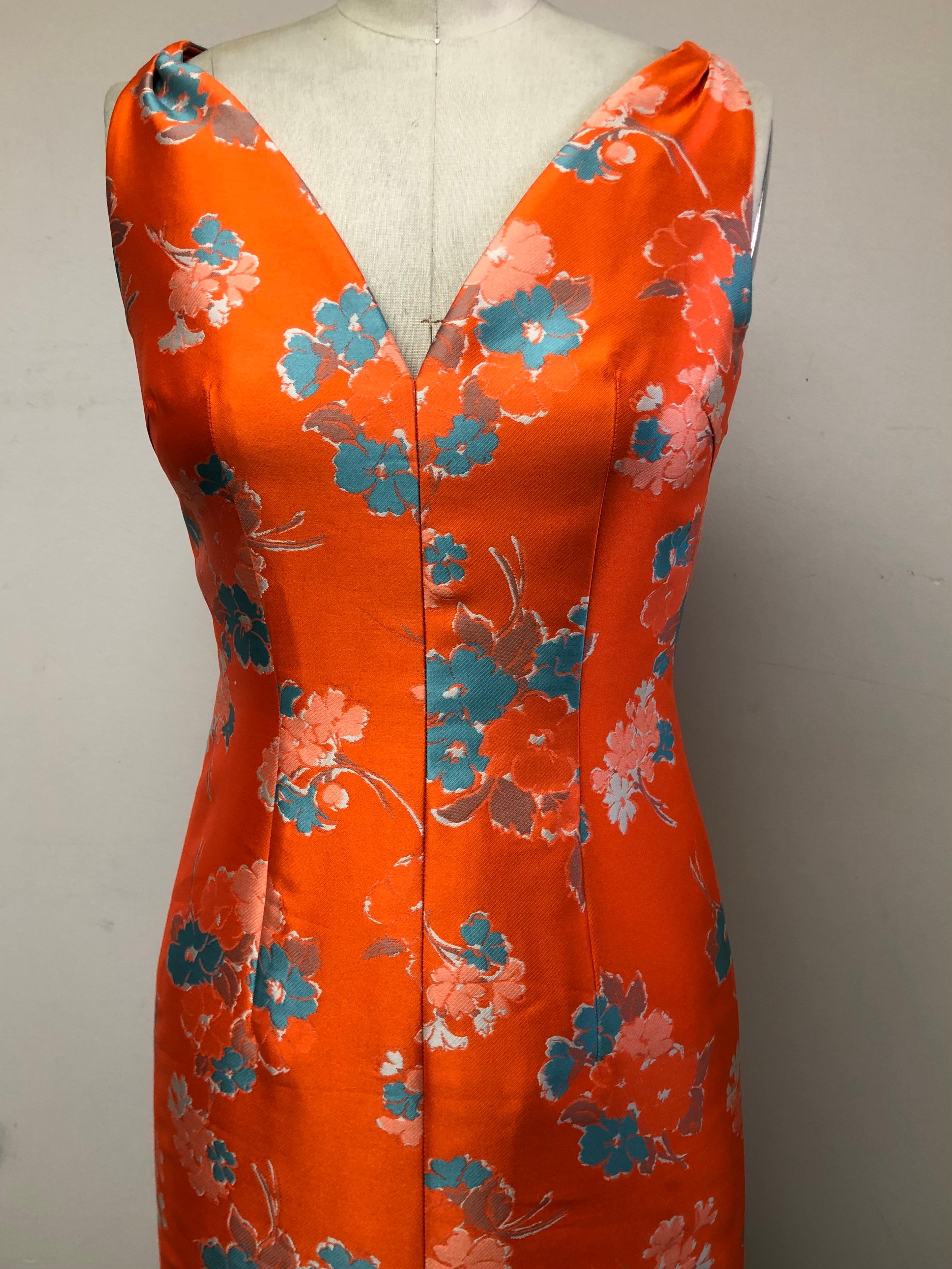 Vibrant and Fun V neck Slim Dress Floral Dress  with Coordinating Cropped Jacket in Vibrant Orange and Blue. Front Slit and Cinched Shoulder treatment.  Perfect for day into evening, wedding guest Spring into Summer. Perfect for travel. 
